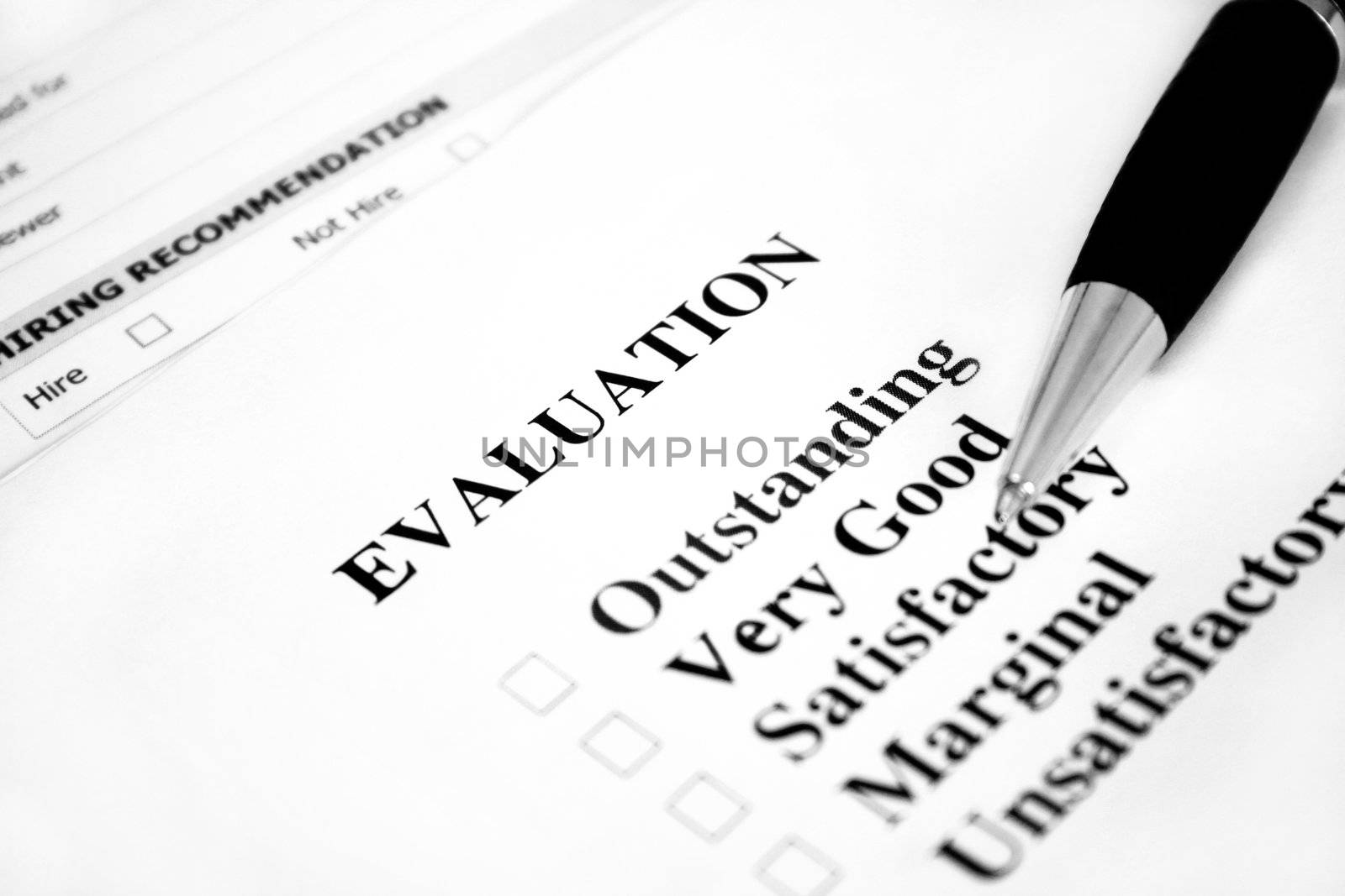 Blank evaluation with a pen. Used a shallow depth of field with selective focus.