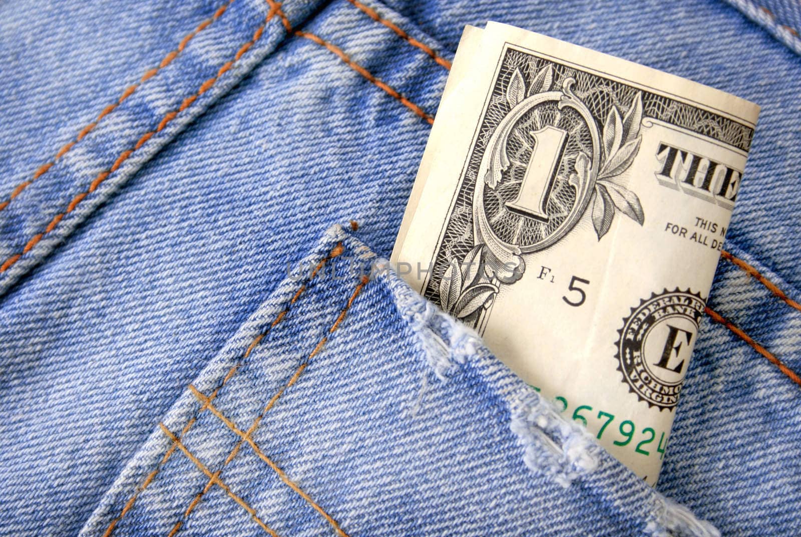 Dollar bill sticking out of a pocket.