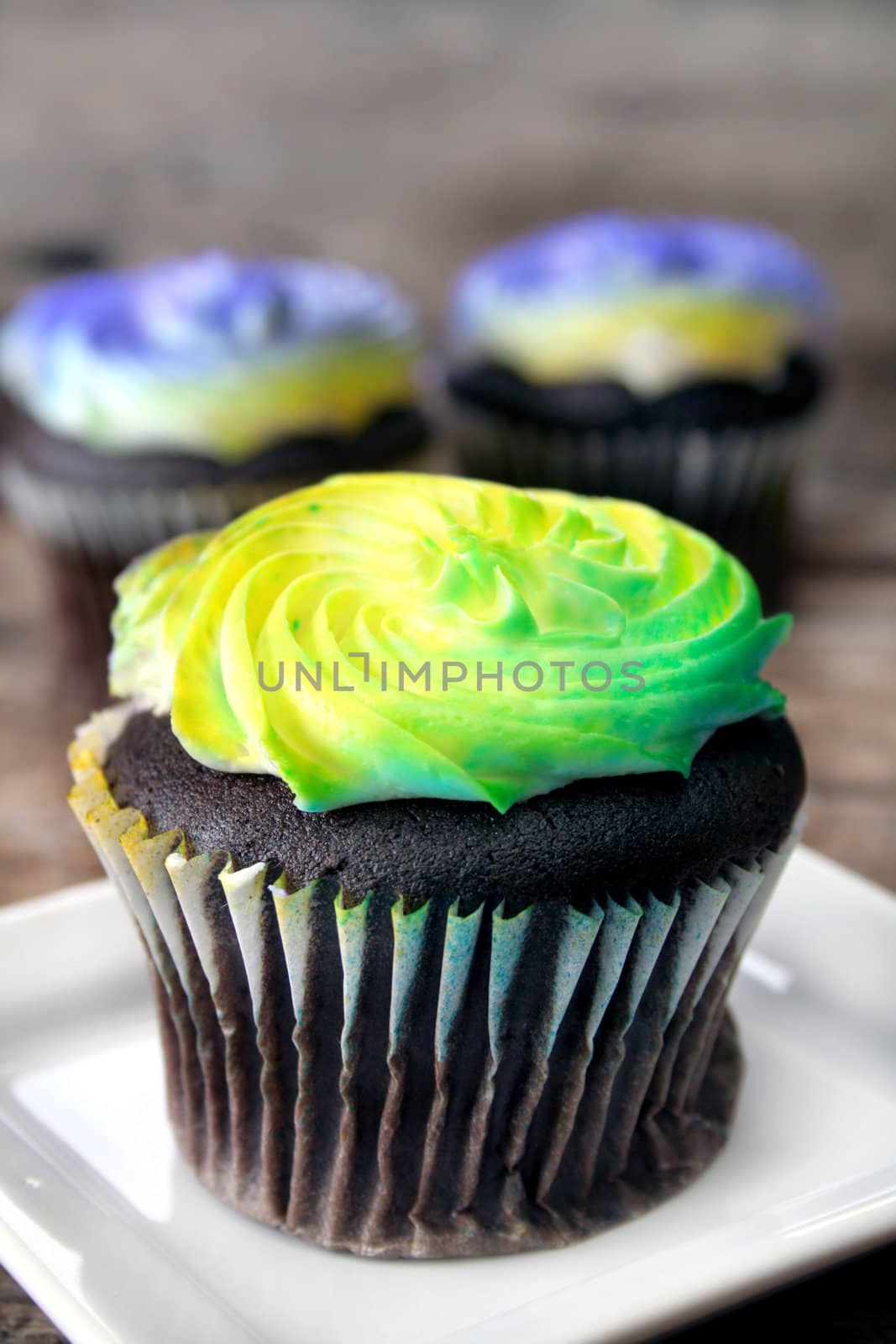 Close up of a cupcake that is very colorful.  