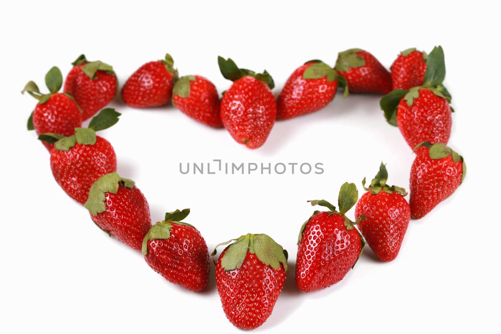 Strawberries in the shape of a heart, shallow dof