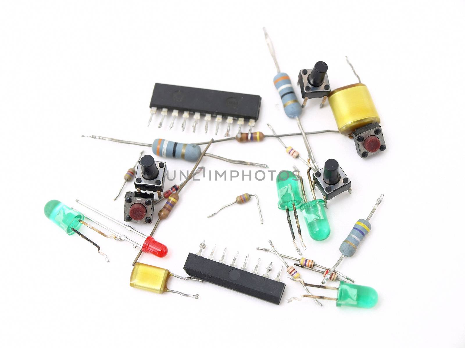 A variety of switches and LED light pieces isolated on a white background.