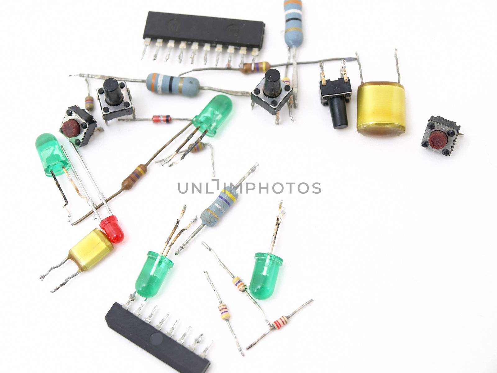 A variety of switches and LED light pieces isolated on a white background.