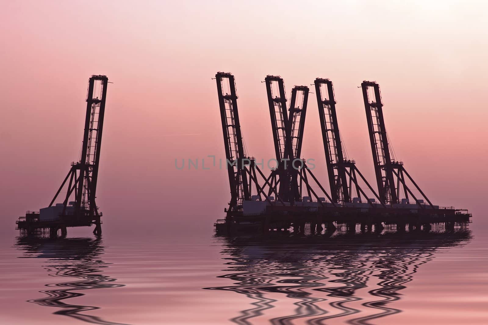 Hoisting cranes in Amsterdam harbor in the Netherlands by devy