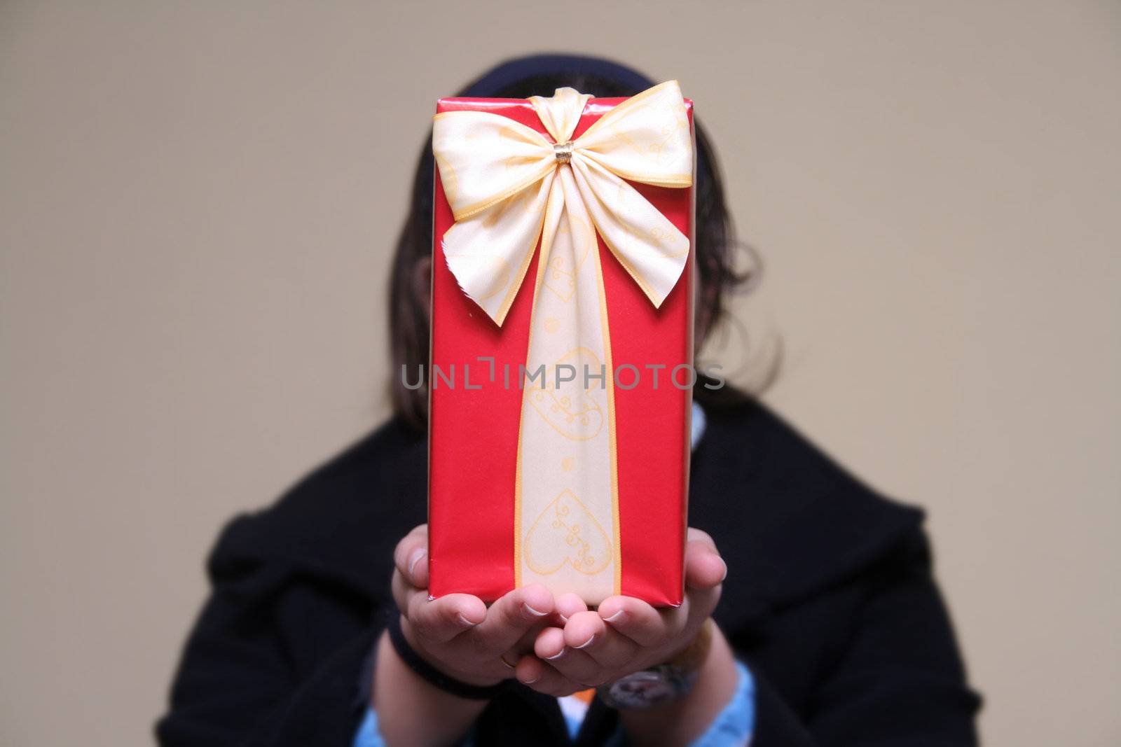 young girl giving gifts (focus on the present)