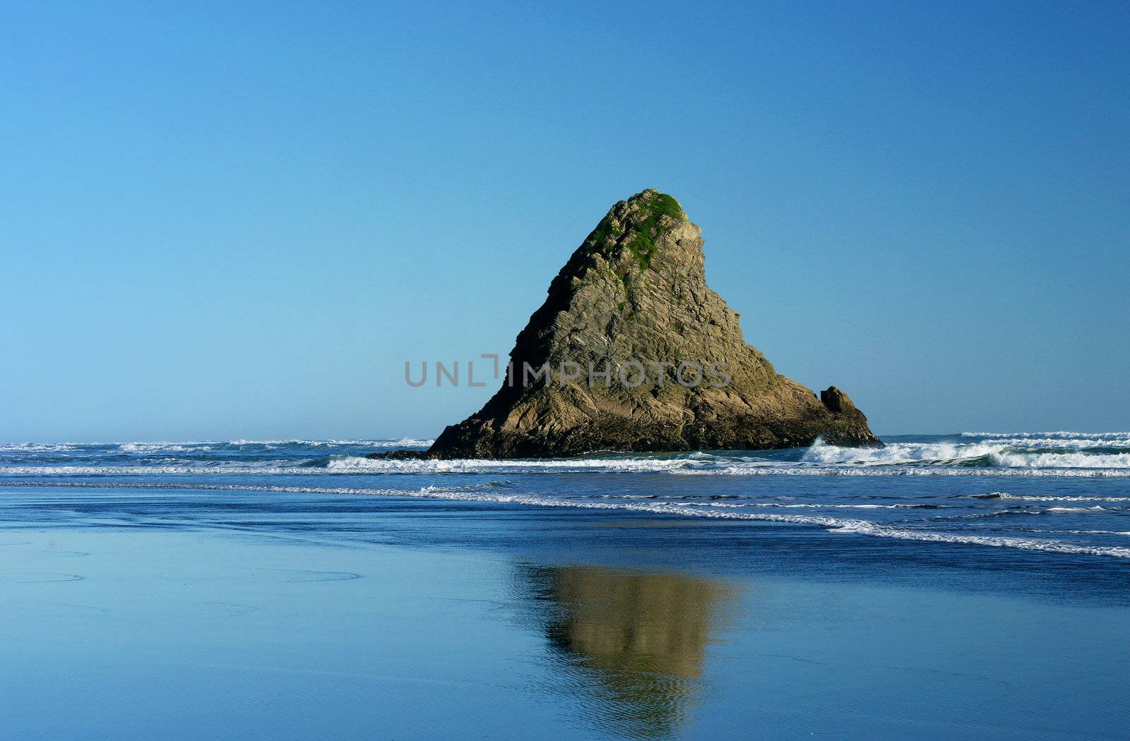 A small rocky outcrop at Karekare, a West Coast Beach near Auckland, New Zealand.

