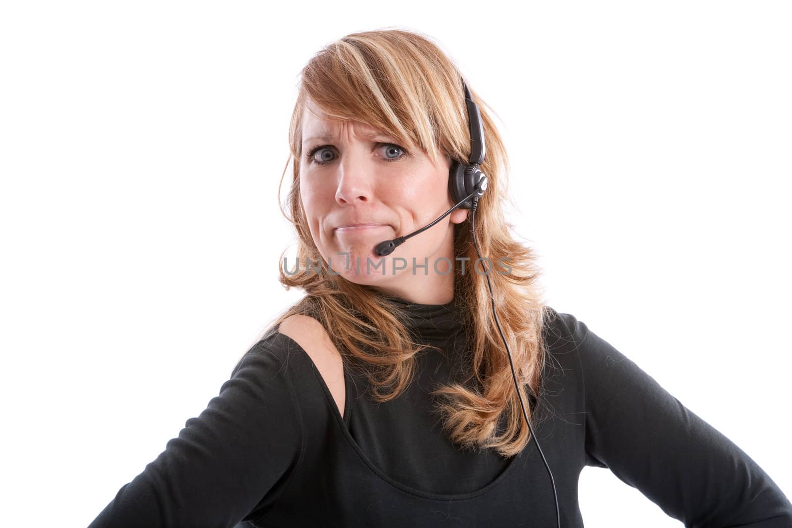 Pretty cute blond girl with headset looking angry on white background