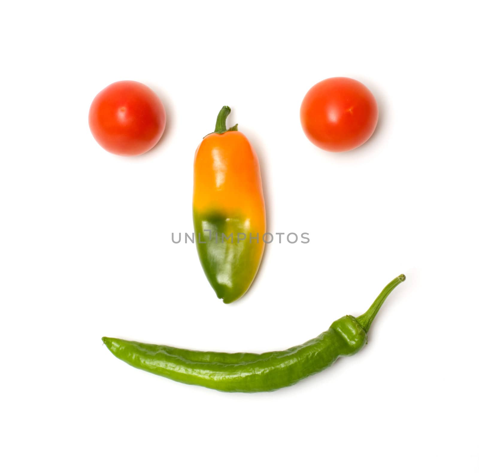 Smiling face of fresh vegetables isolated on a white background.