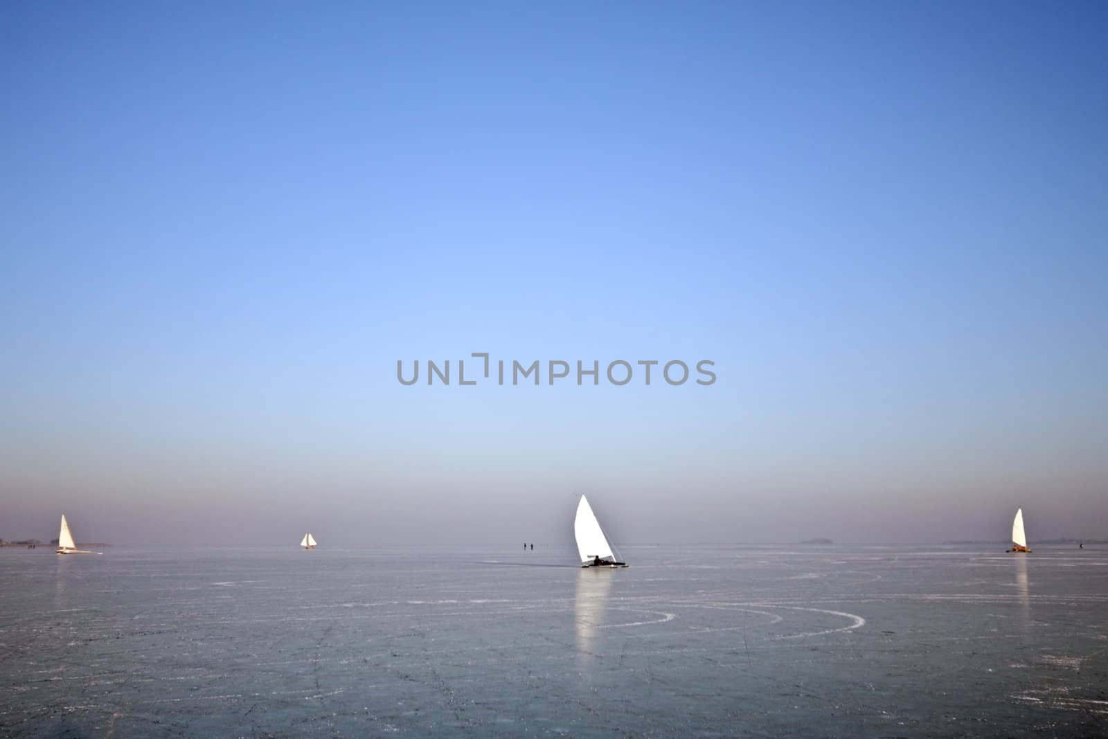 Traditional dutch: Ice sailing on a cold winterday on the Gouwzee in the Netherlands