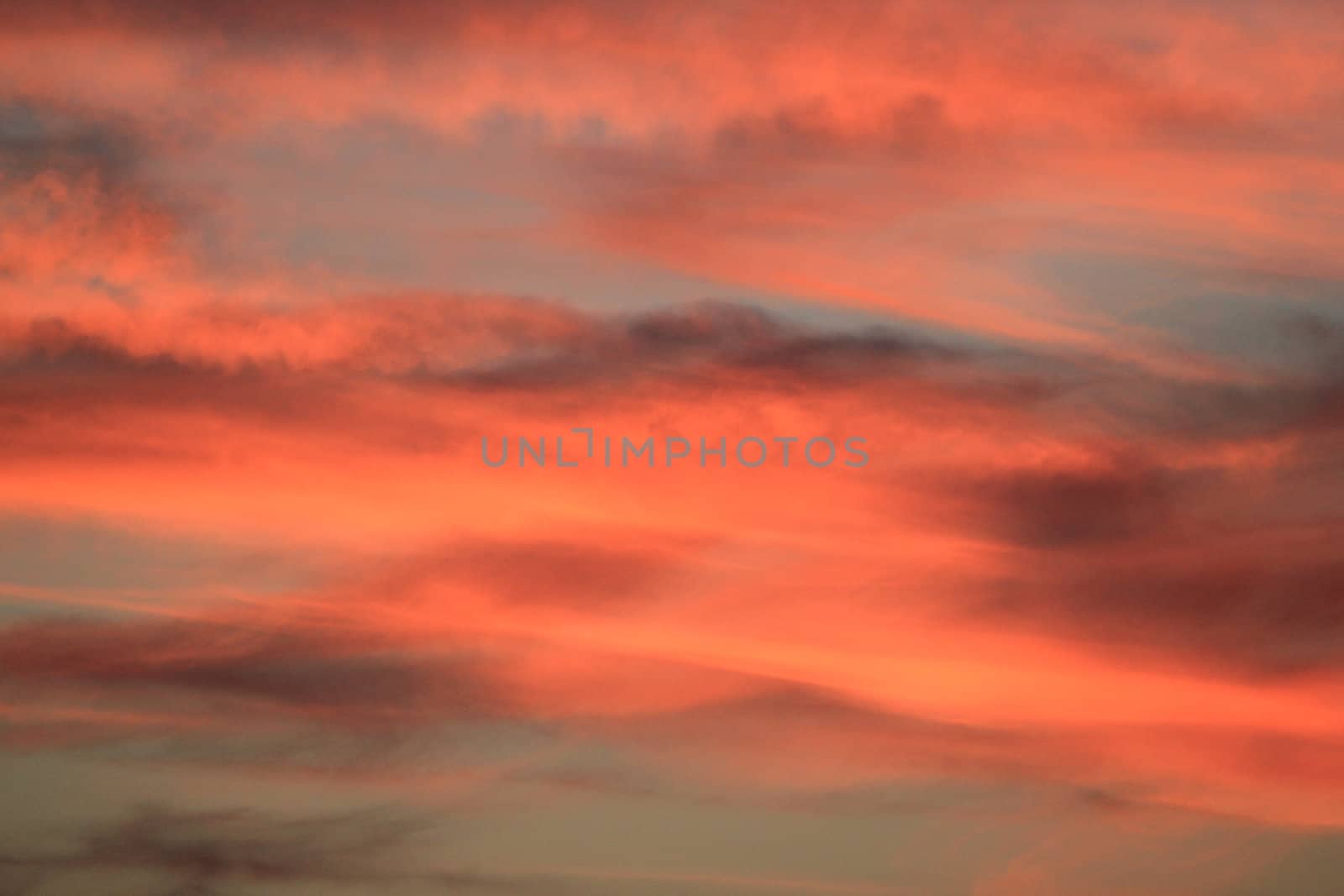 Red and orange cloudy sky by sunset