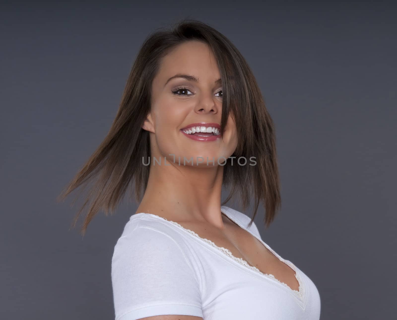 Portrait of attractive young woman brunette smiling.