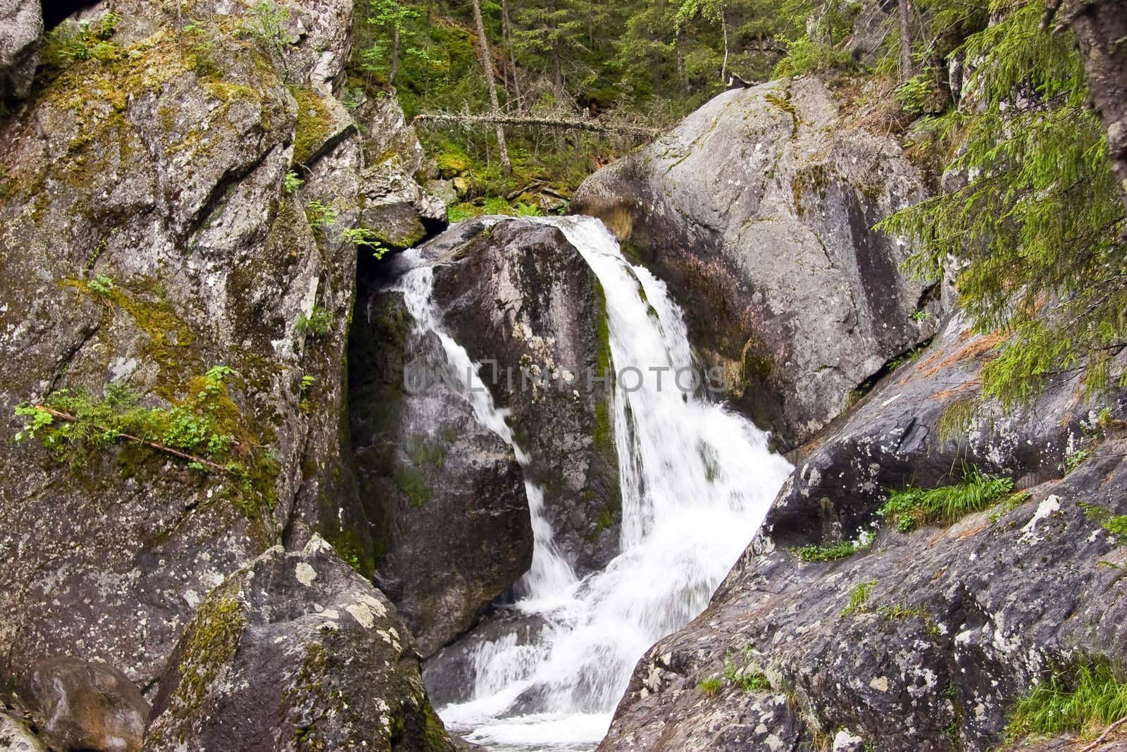 A waterfall is in the Ural mountains