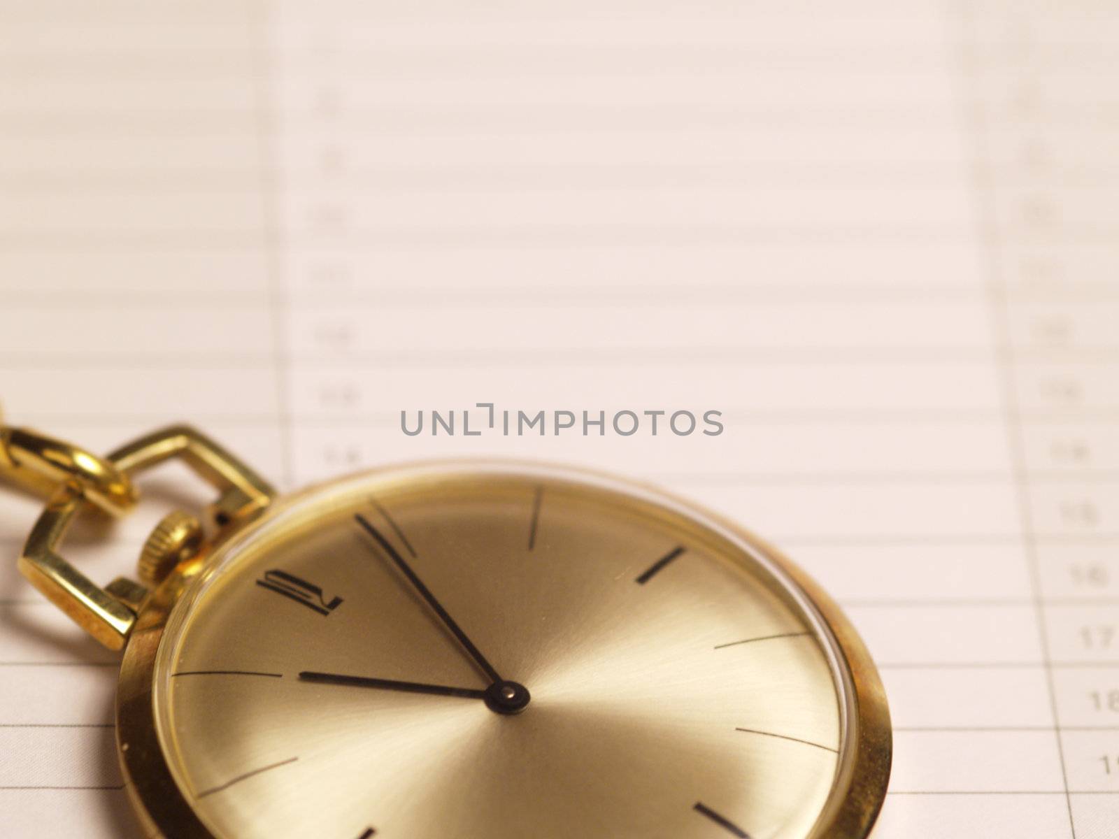 gold pocket watch on schedule