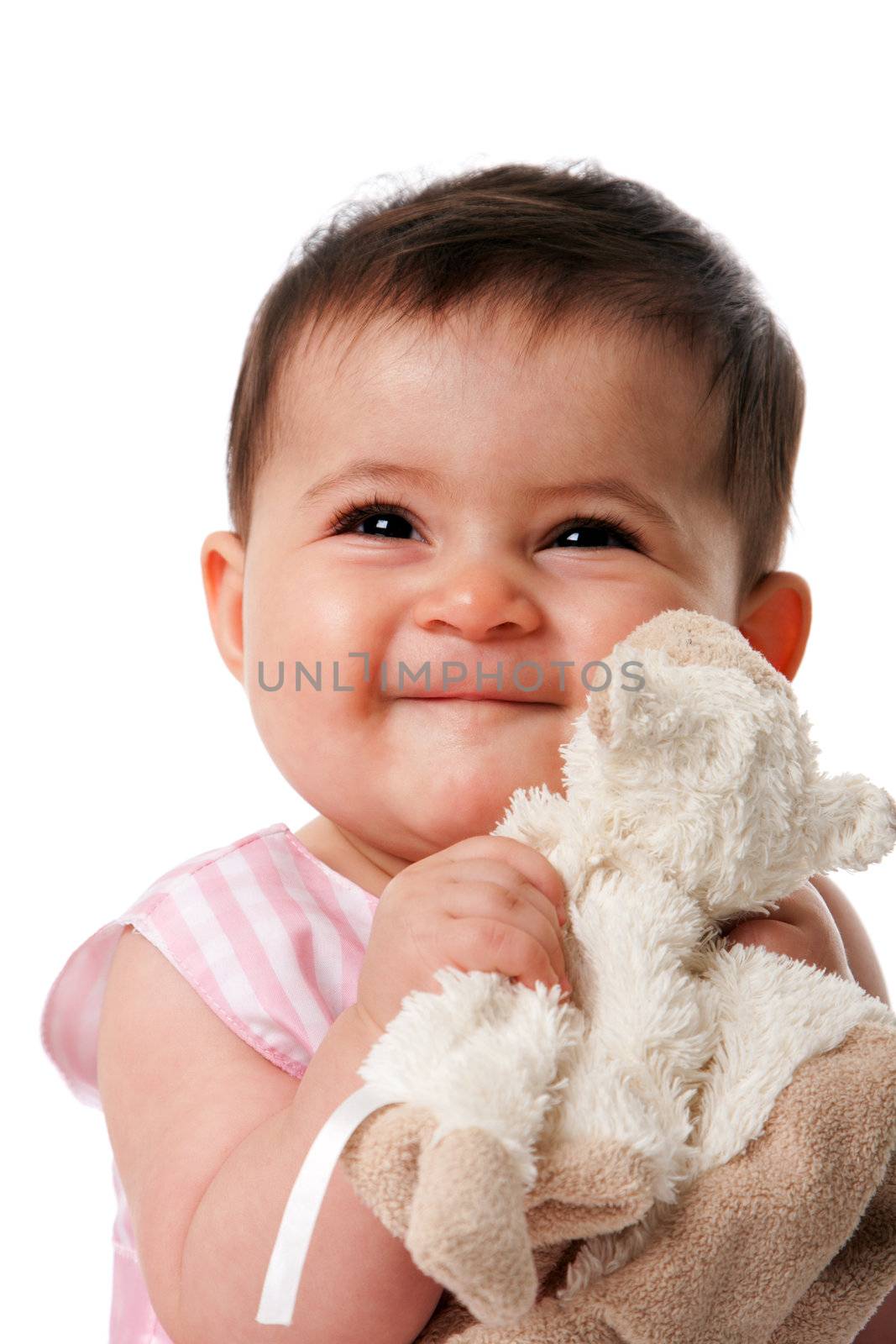 Beautiful happy cute baby girl smiling face with security blanket toy, isolated.