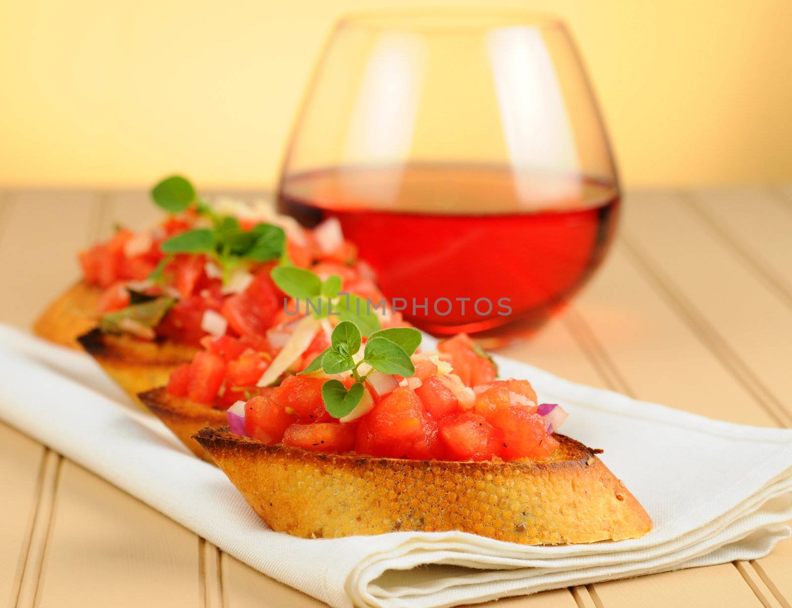 Delicious homemade bruschetta appetizer on a napkin.