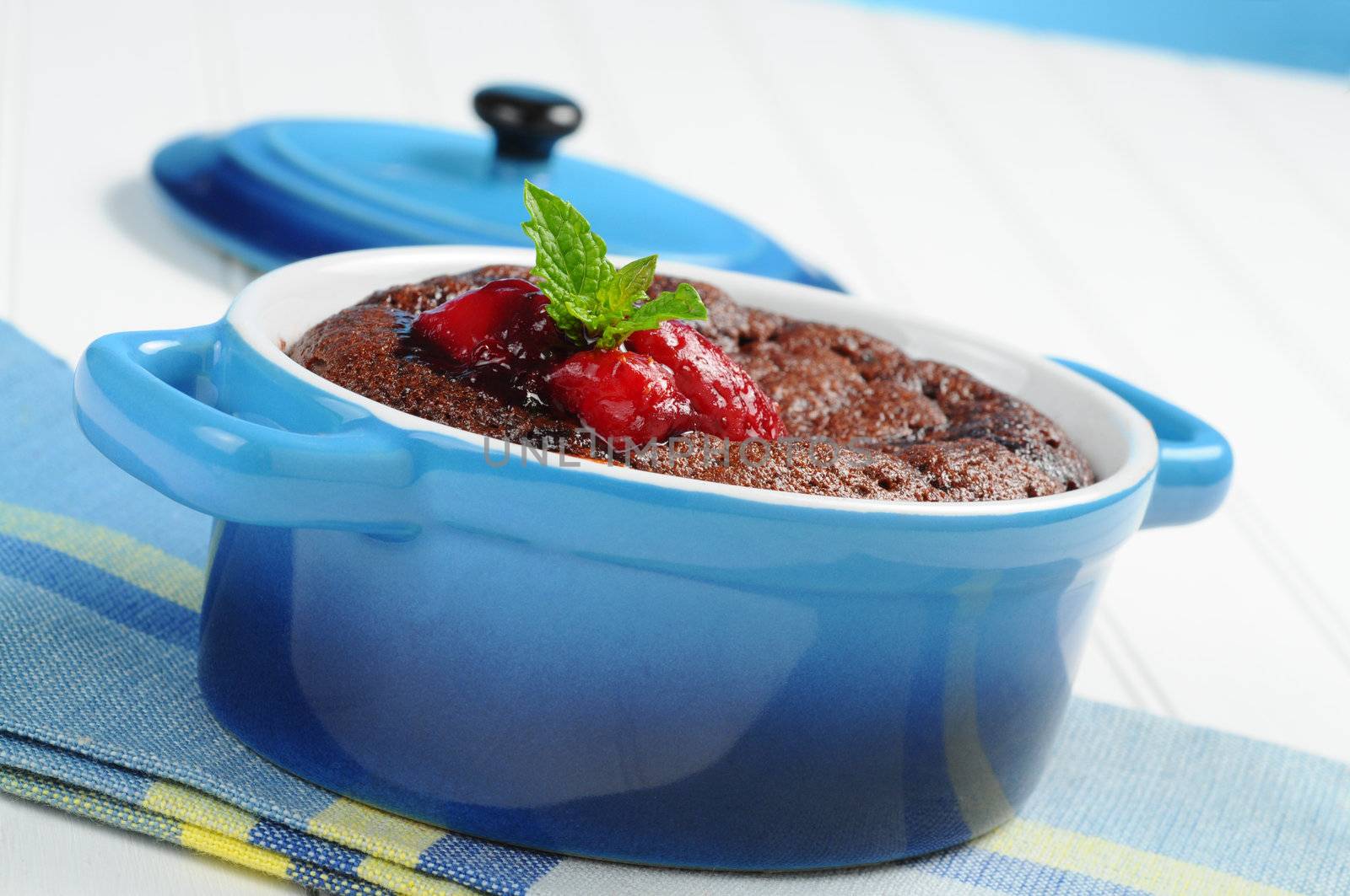 Delicious warm molten lava cake with berries.