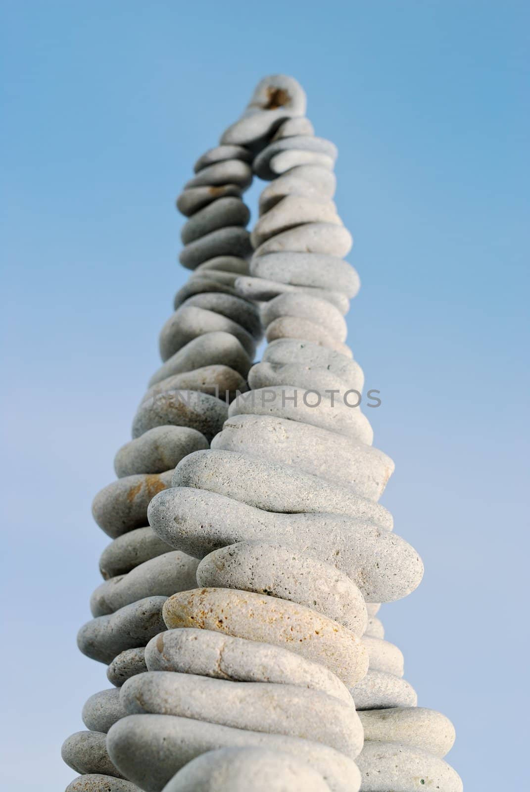 High stone pyramid against the pure sky in the summer