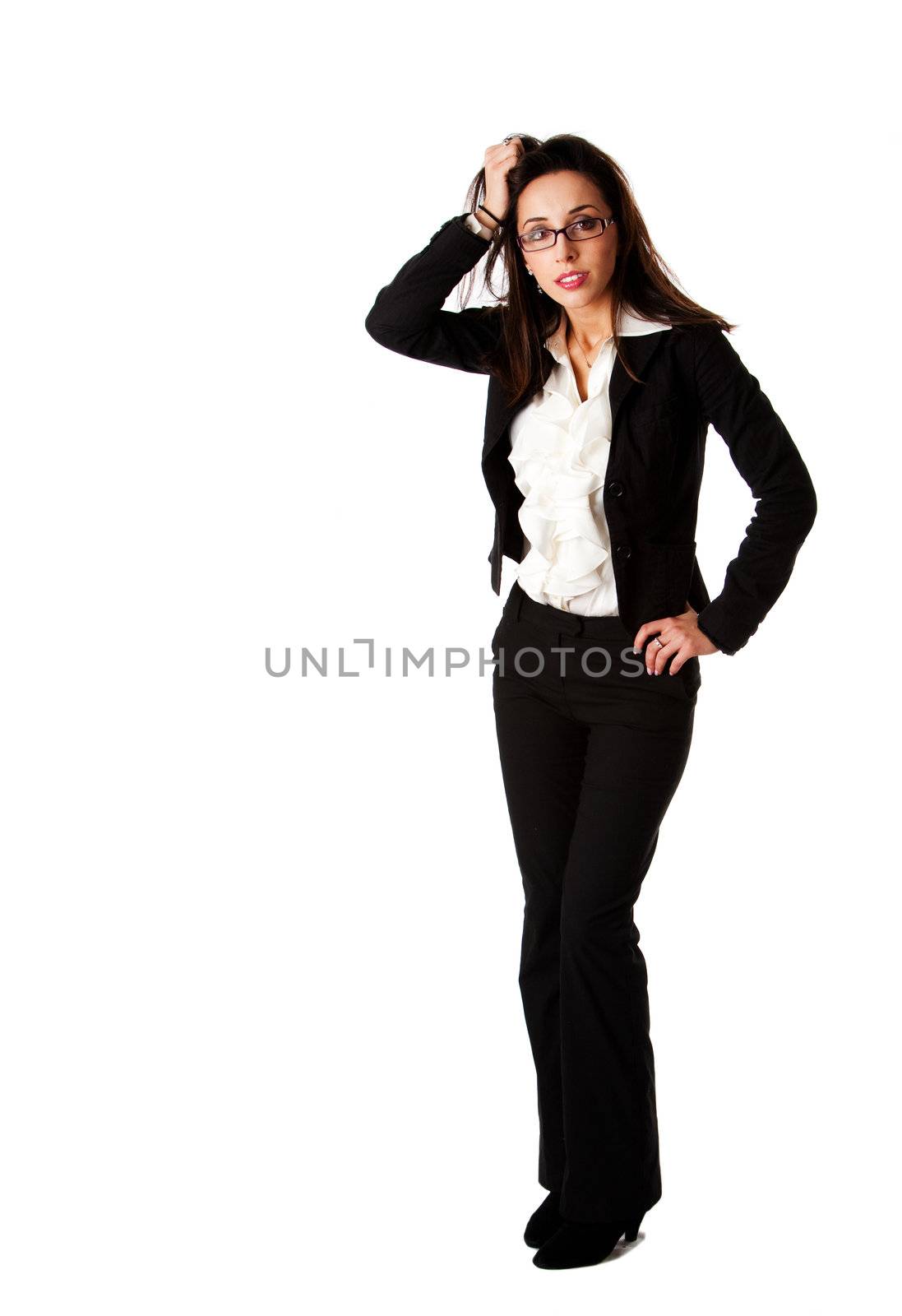 Beautiful stressed burned-out successful Caucasian Hispanic entrepreneur business woman standing, wearing black suit, white ruffled shirt and glasses, hand pulling hair, isolated.
