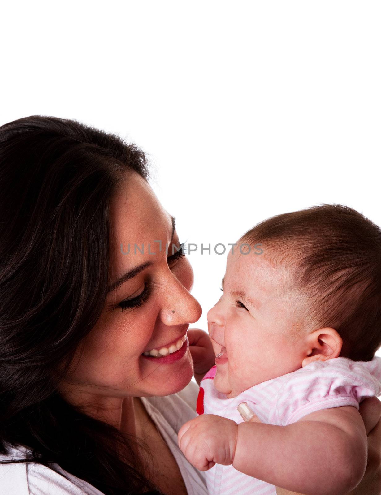 Faces of beautiful family couple of mother and daughter baby girl looking at eachother having fun and laughing, isolated.