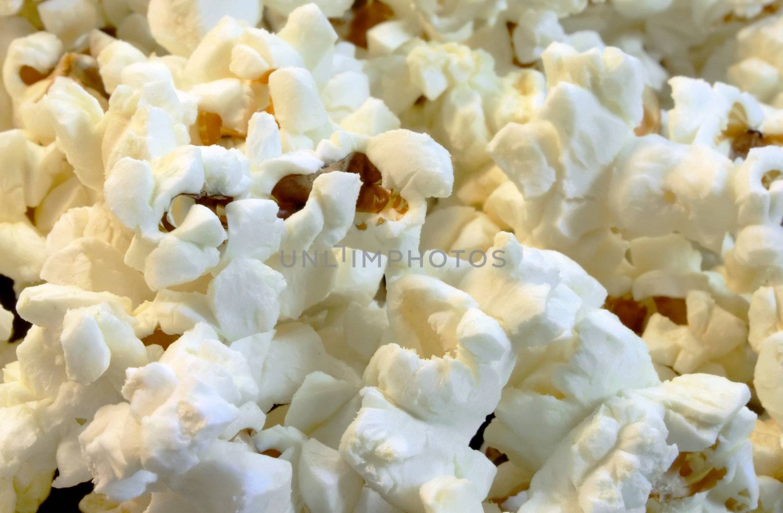Scattered flakes of salty popcorn. Photo close-up