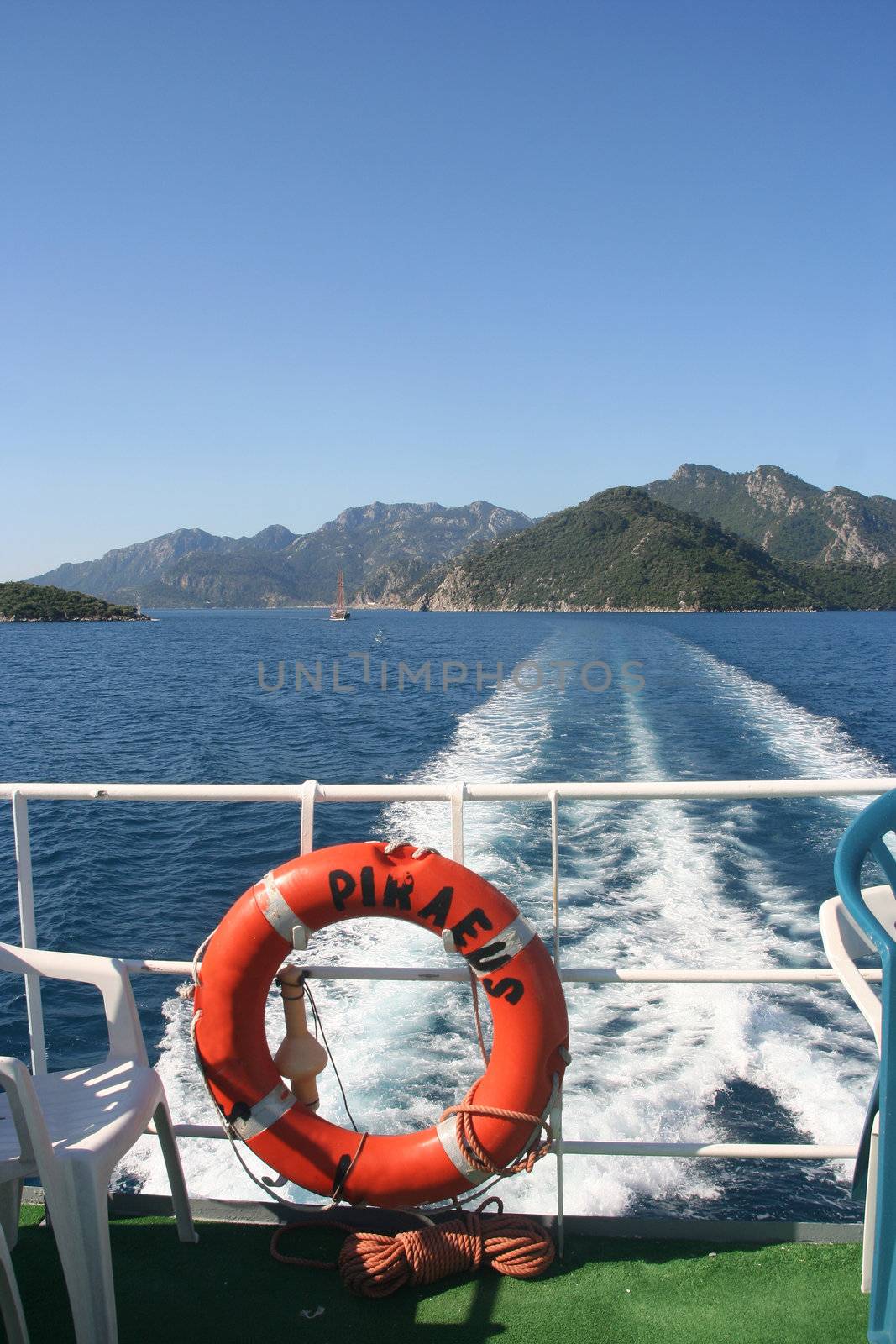 Lifebuoy on the ferry to Piraeus and ship's wake