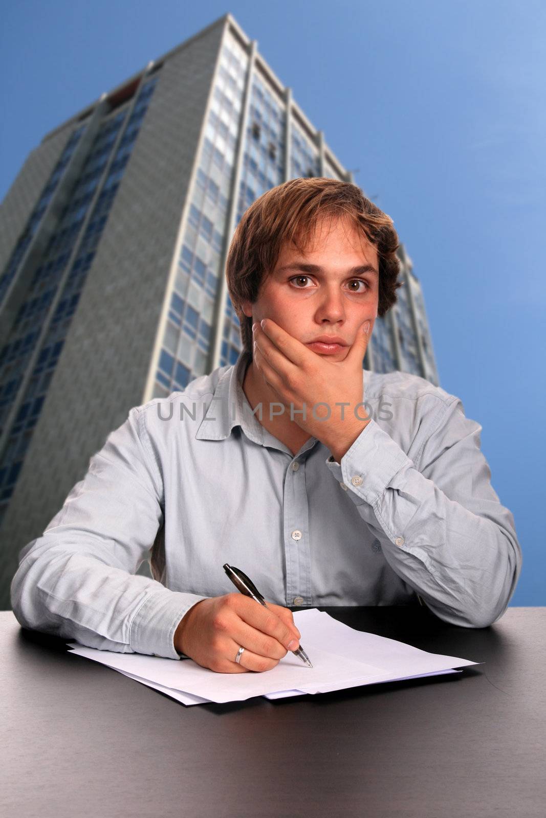 businessman signing contract over white background