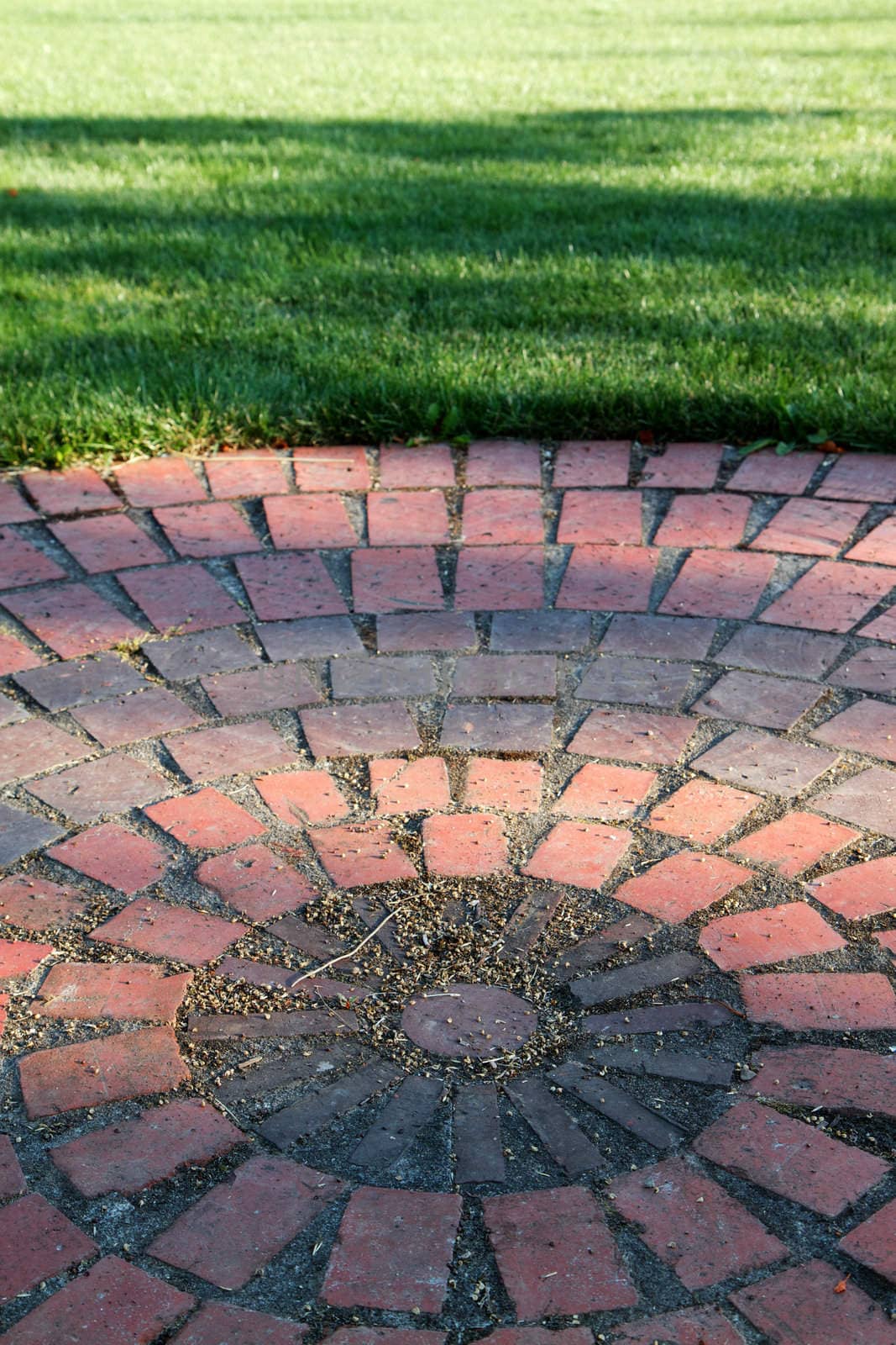 Brick circle and grass by bobkeenan