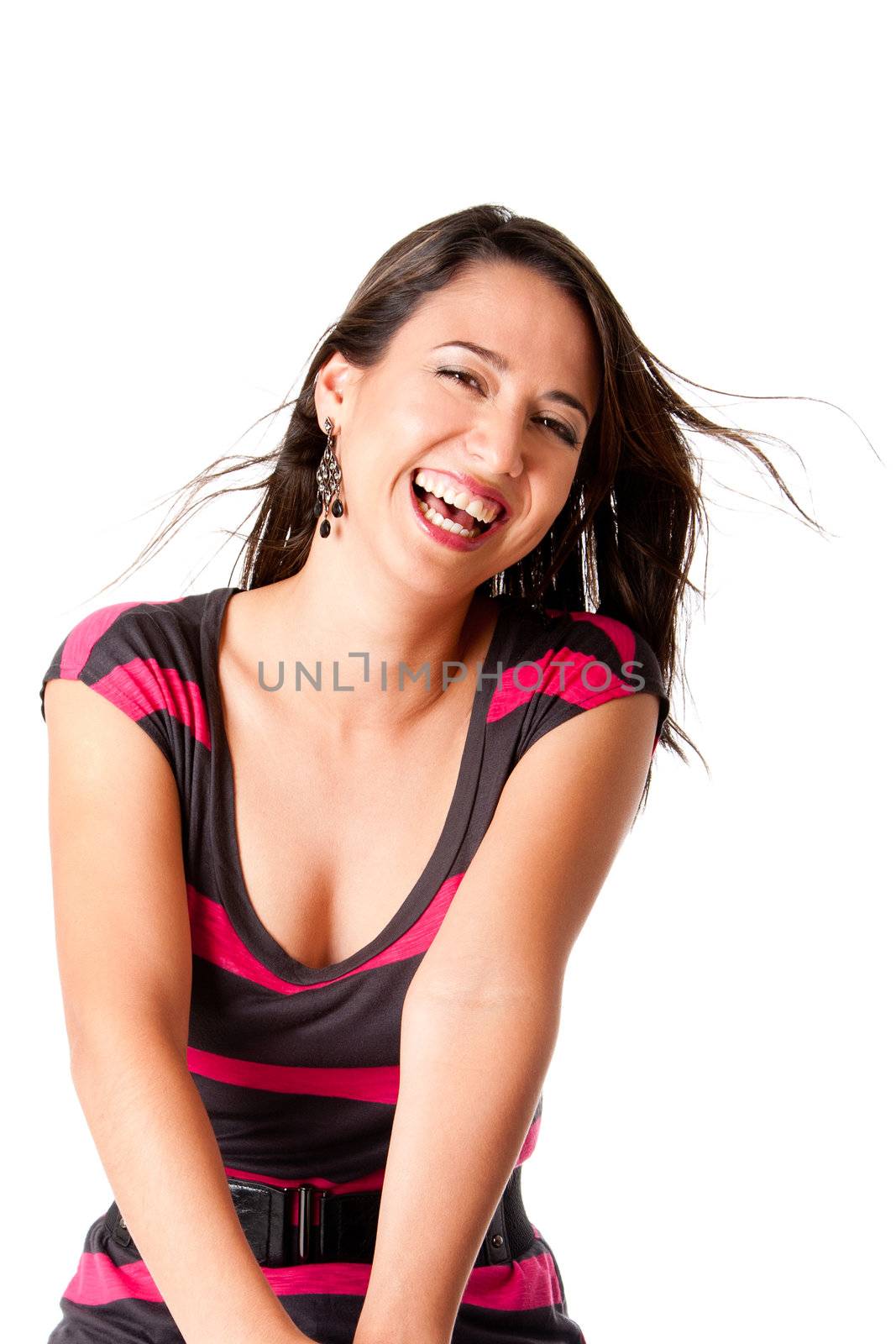 Beautiful laughing young woman with twirling brown hair having lots of fun, isolated.