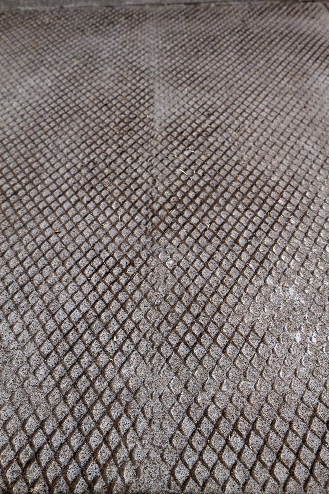Diamond pattern Serrated concrete on a sidewalk