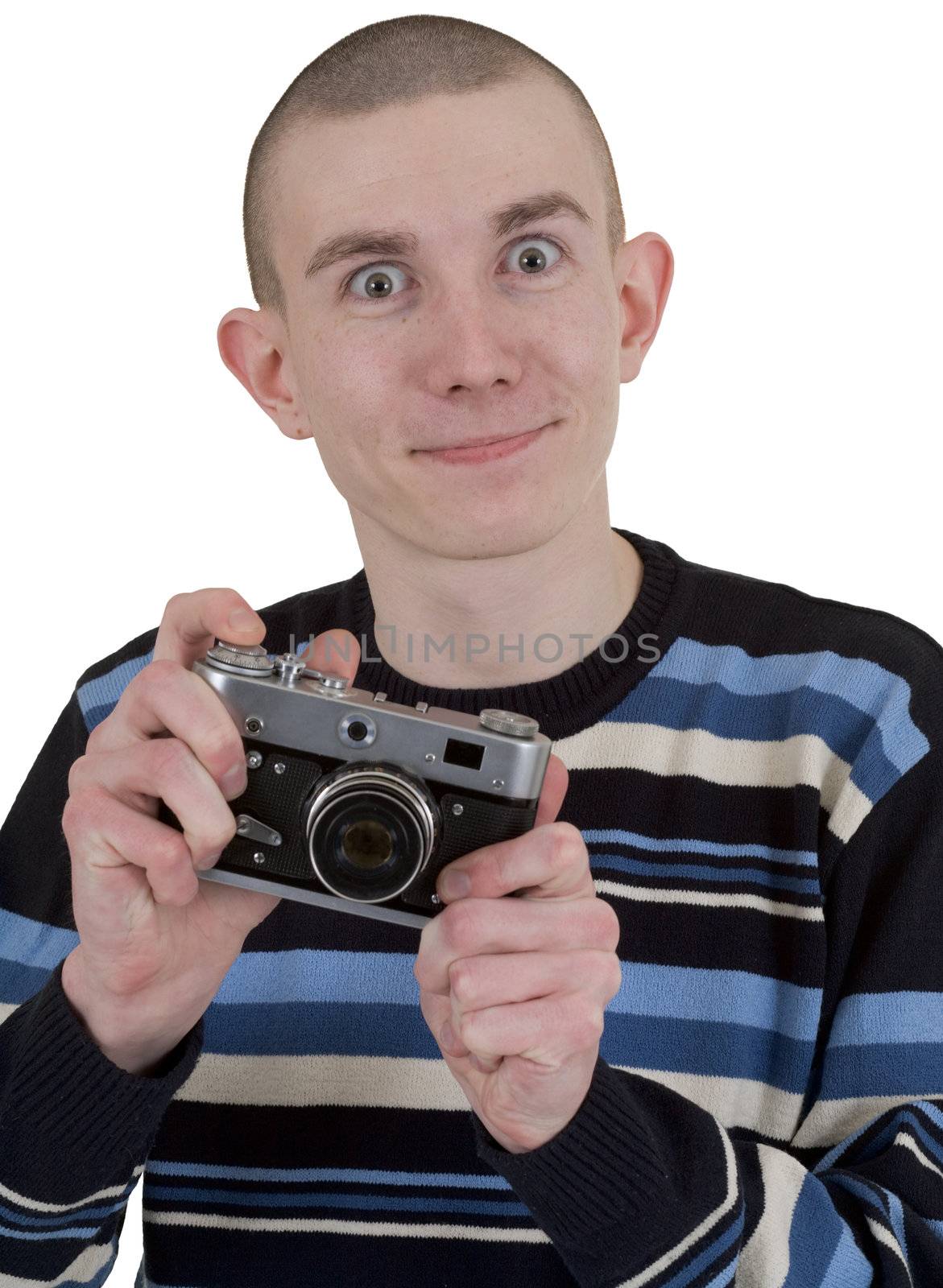 Young man holding camera in hands on white