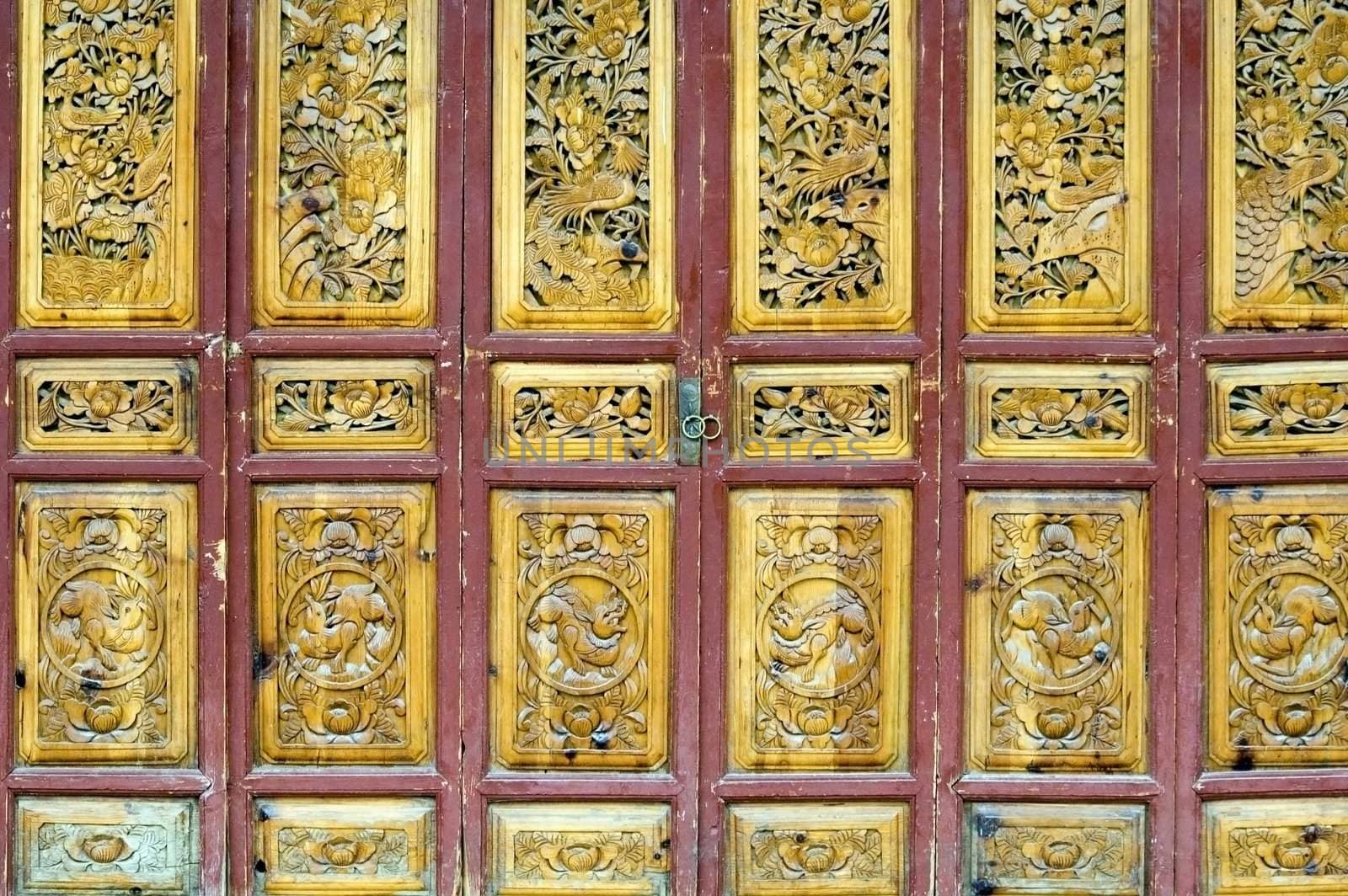 Wooden door in old style, shop entrance. China, Yunnan province, Lijiang - old town. 