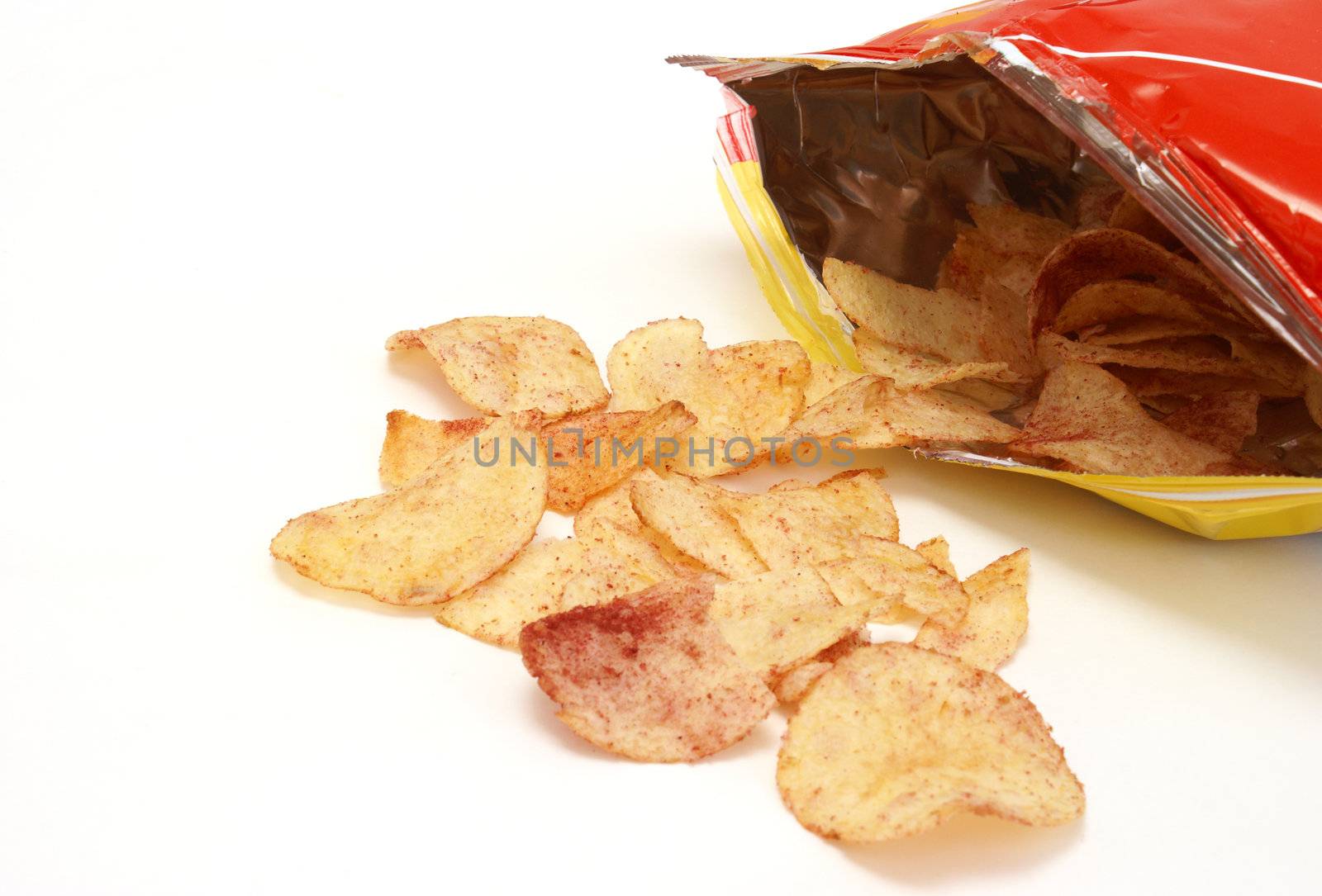 A bag of ketchup chips isolated on white background.