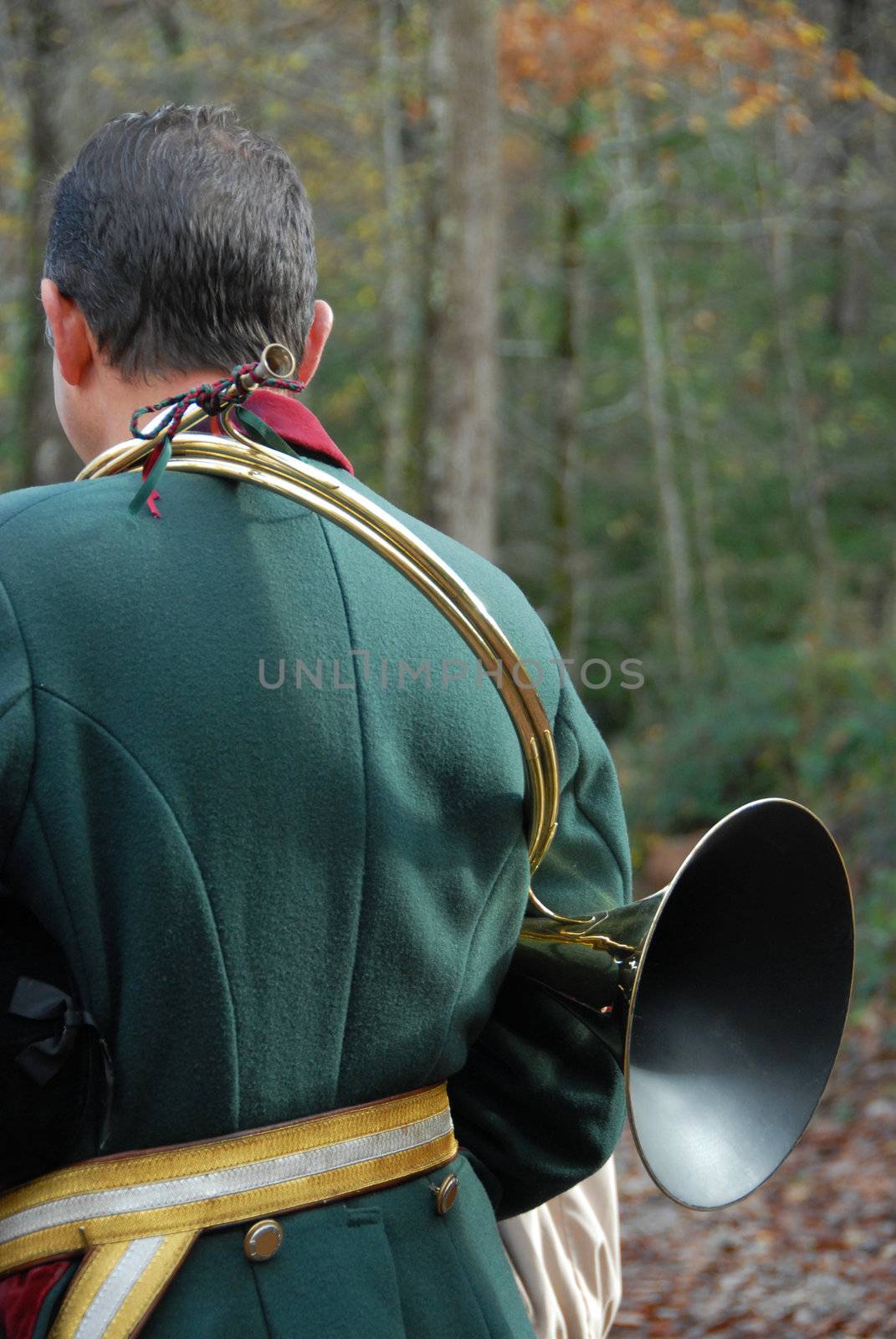 back of hunter in a traditional fox hunting with horn