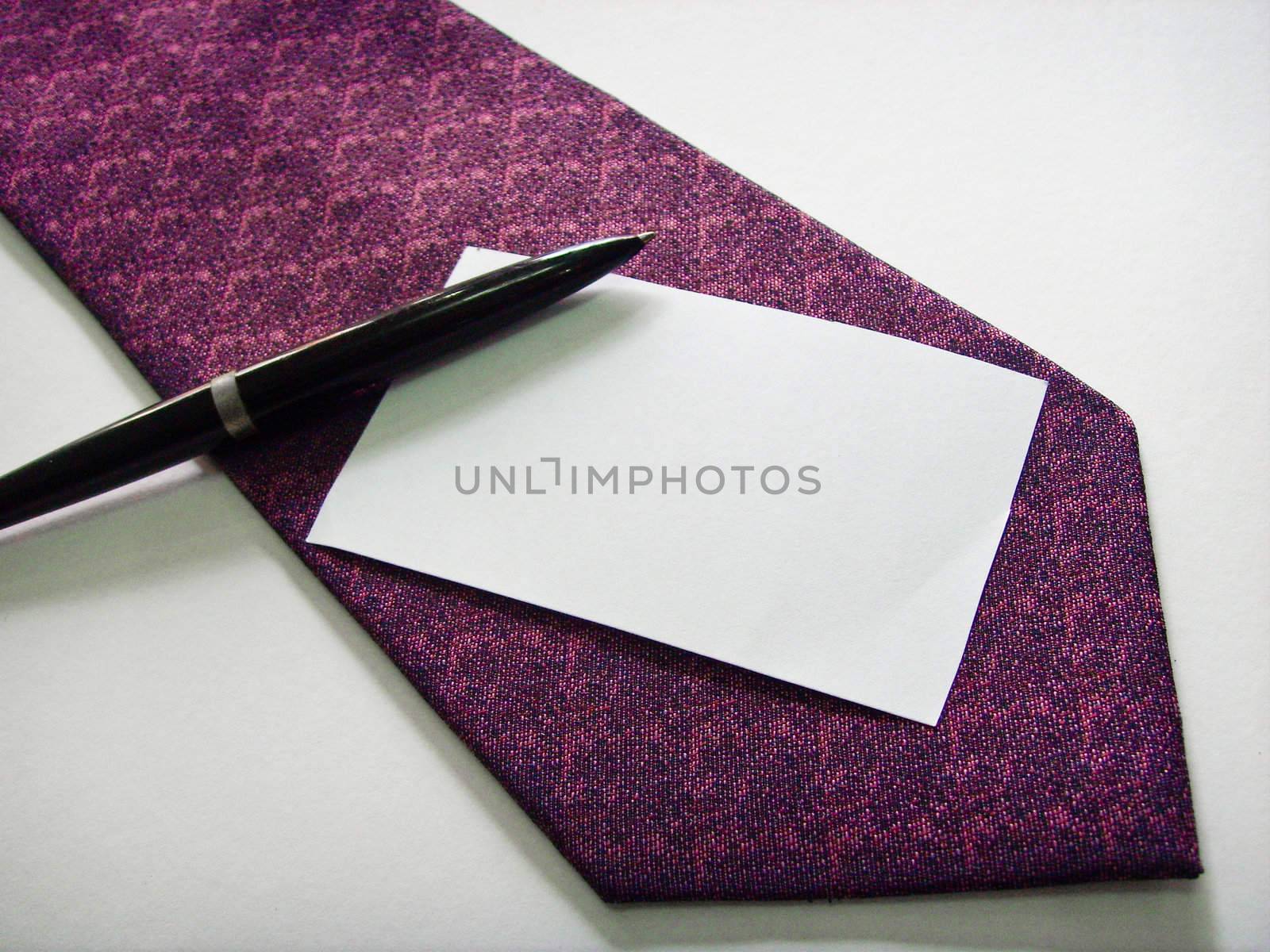 A white name card on a purple tie, on a white background