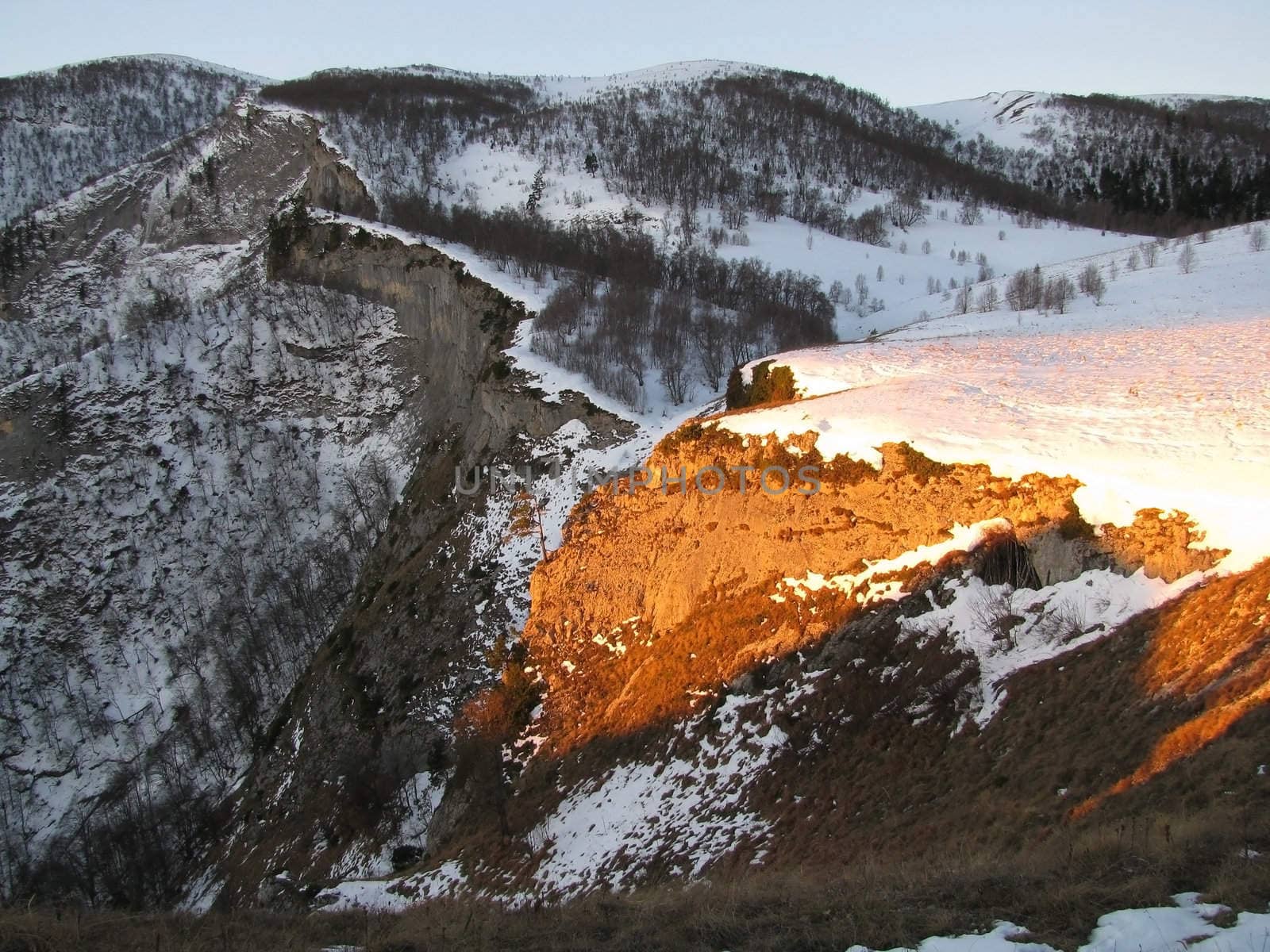 Vegetation; rocks; a relief; a landscape; a hill; a panorama; mountains