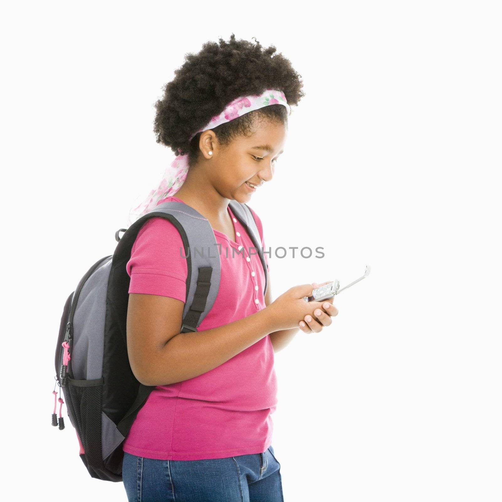 Schoolgirl with phone. by iofoto