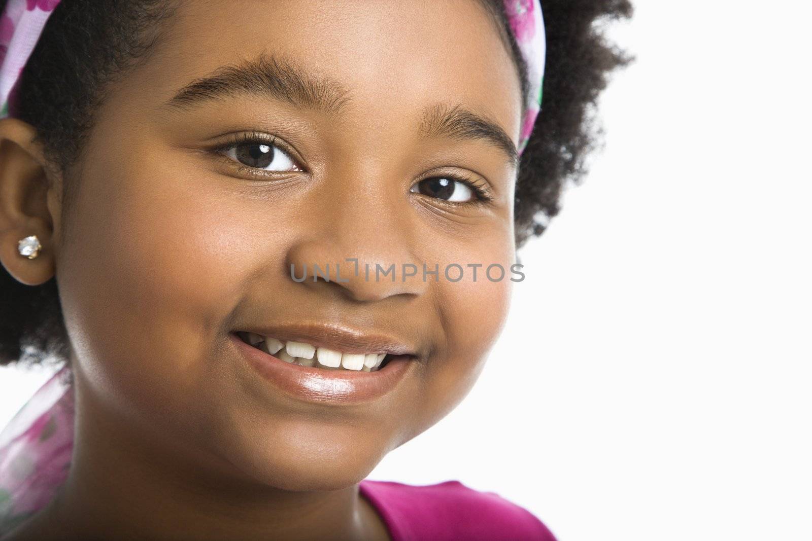 Smiling preteen girl. by iofoto