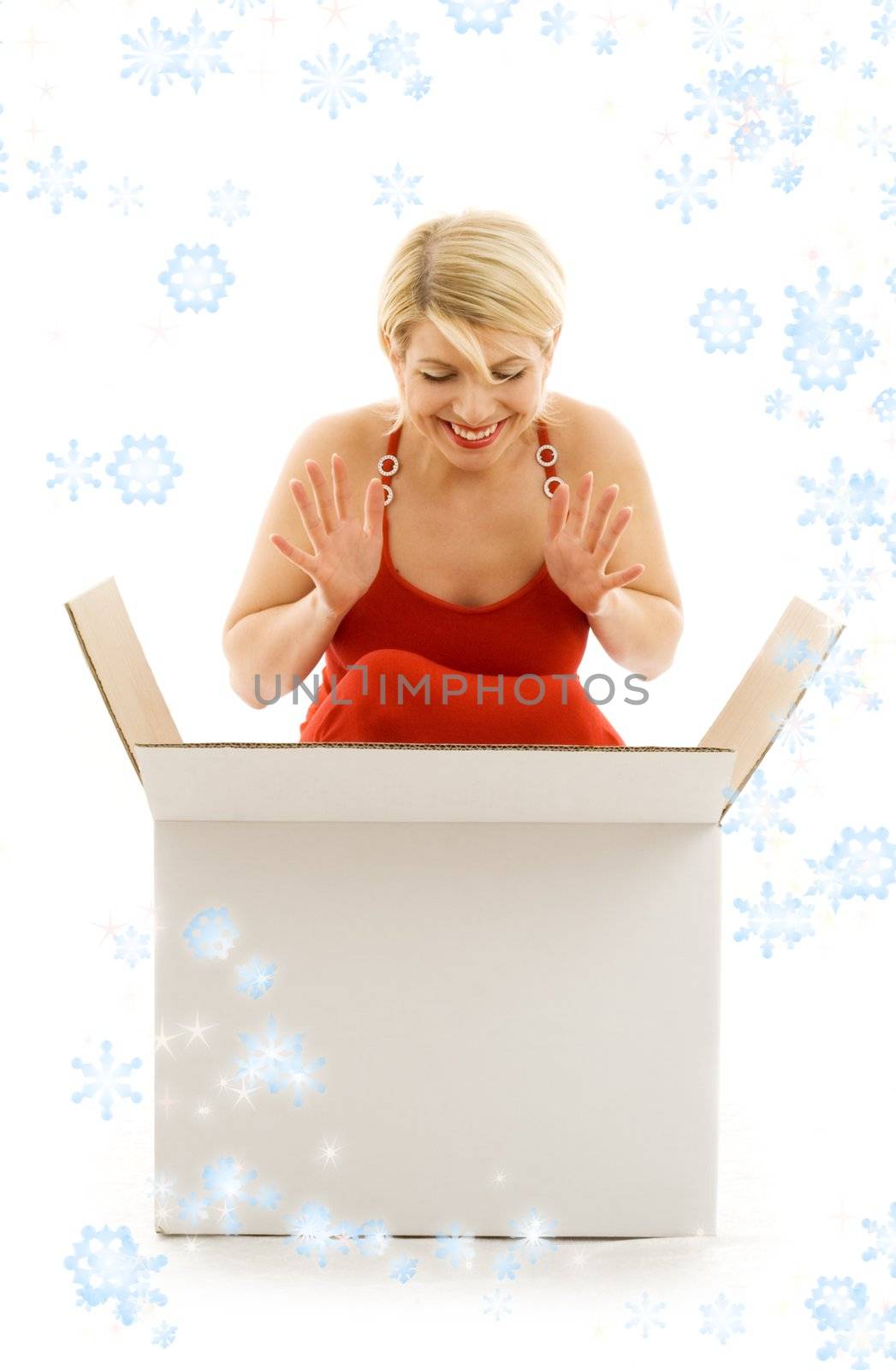 happy girl with blank box surrounded by rendered snowflakes