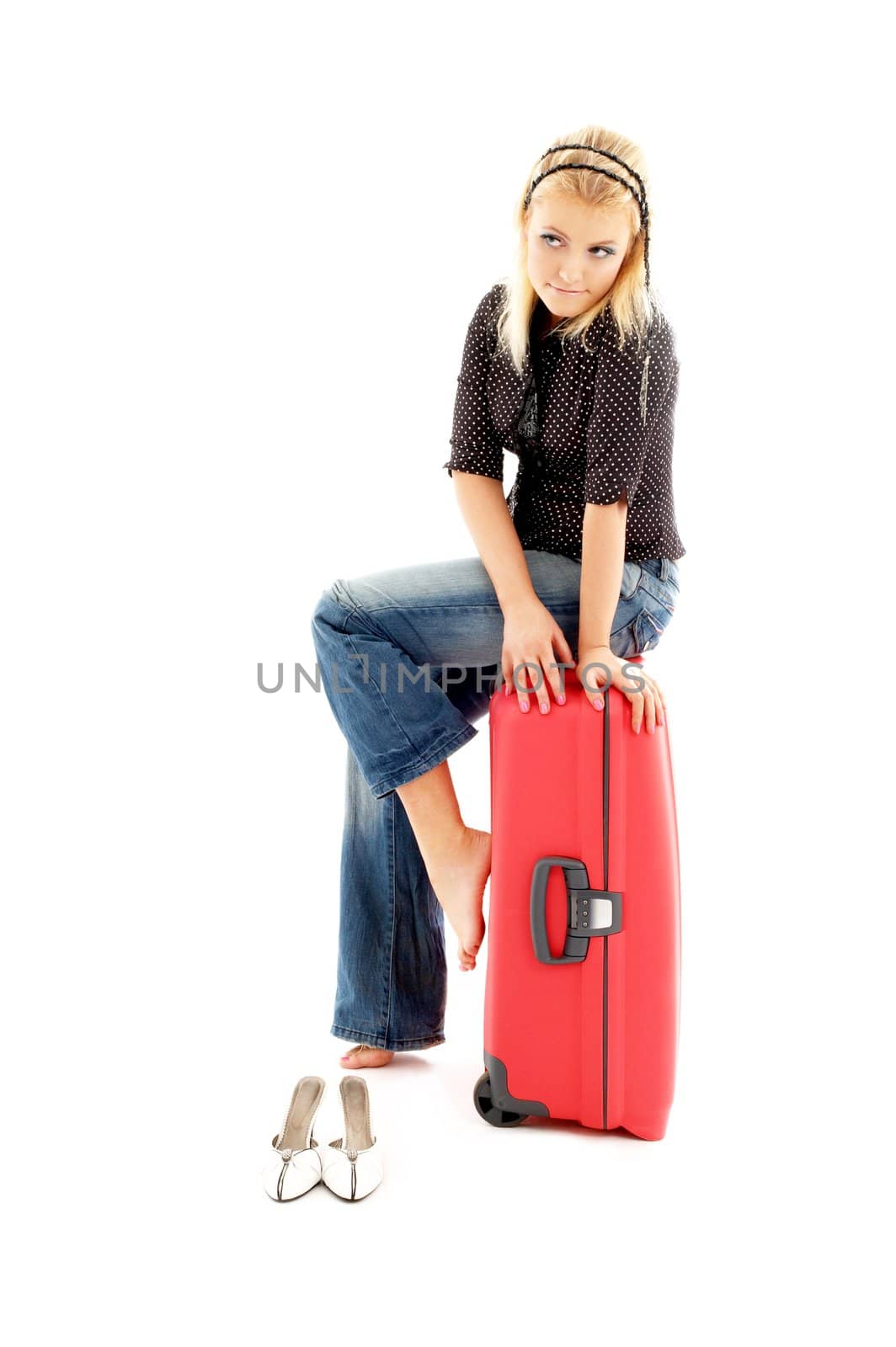 blond girl sitting on red trunk over white