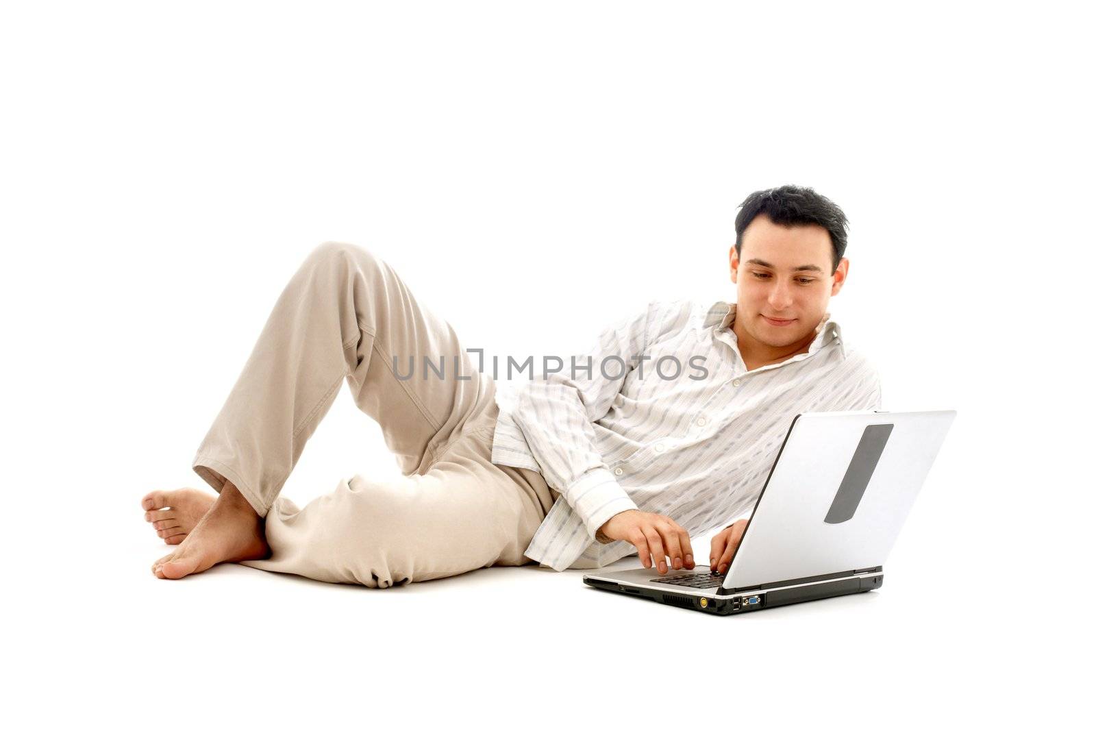relaxed man with laptop by dolgachov