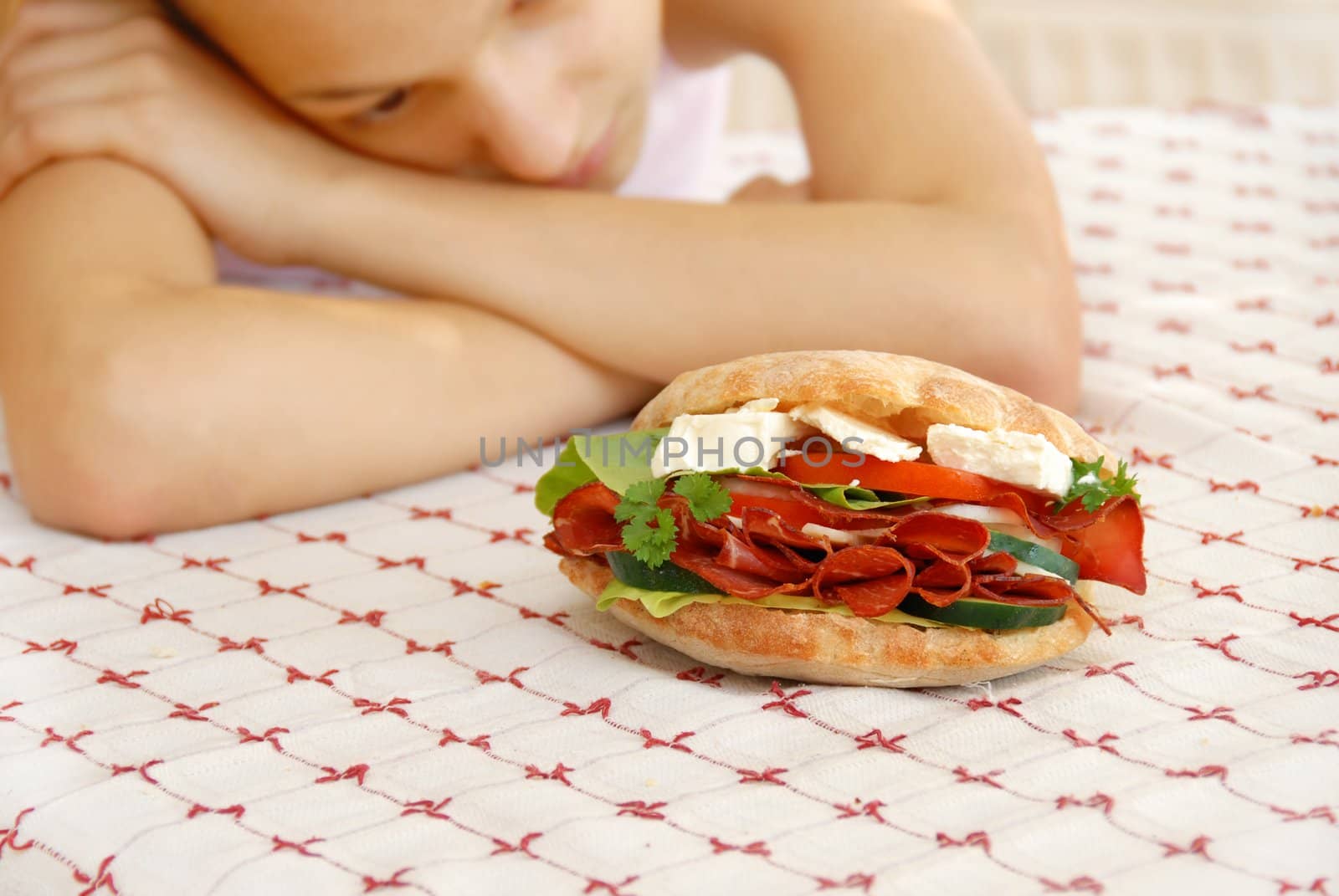 hungry girl hands teen girl by appetizing big sandwich with ham and cheese