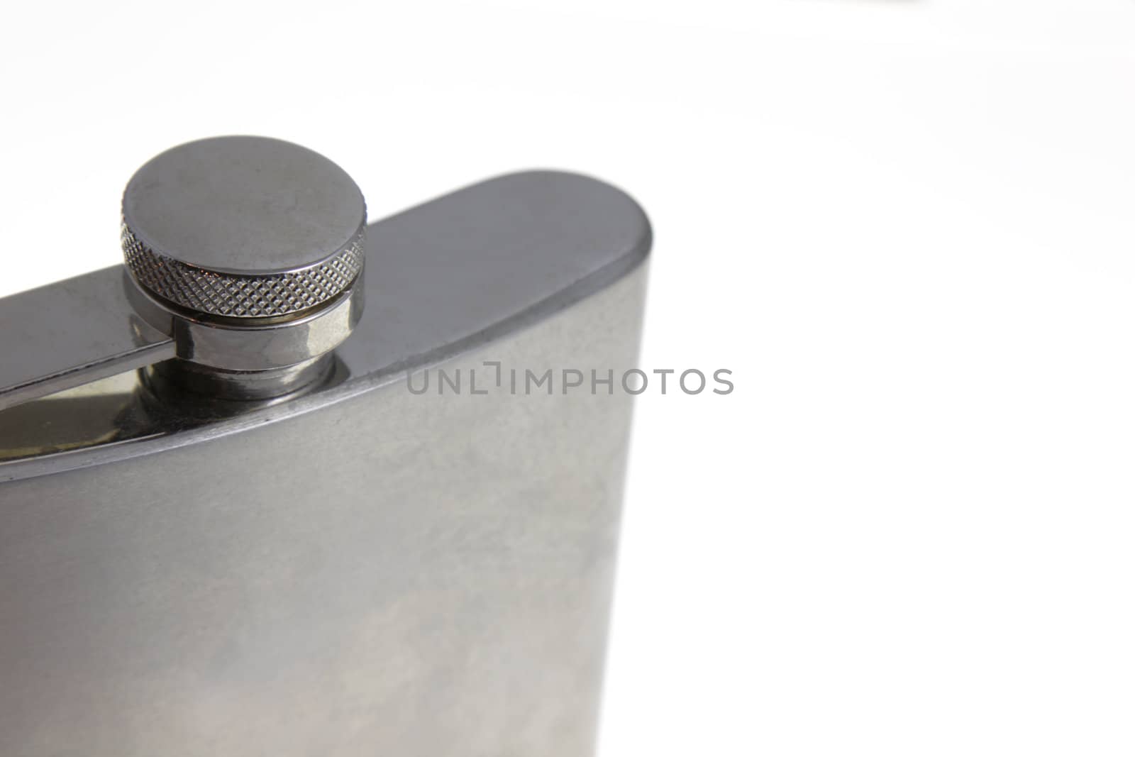 A close up of a metal flask.
