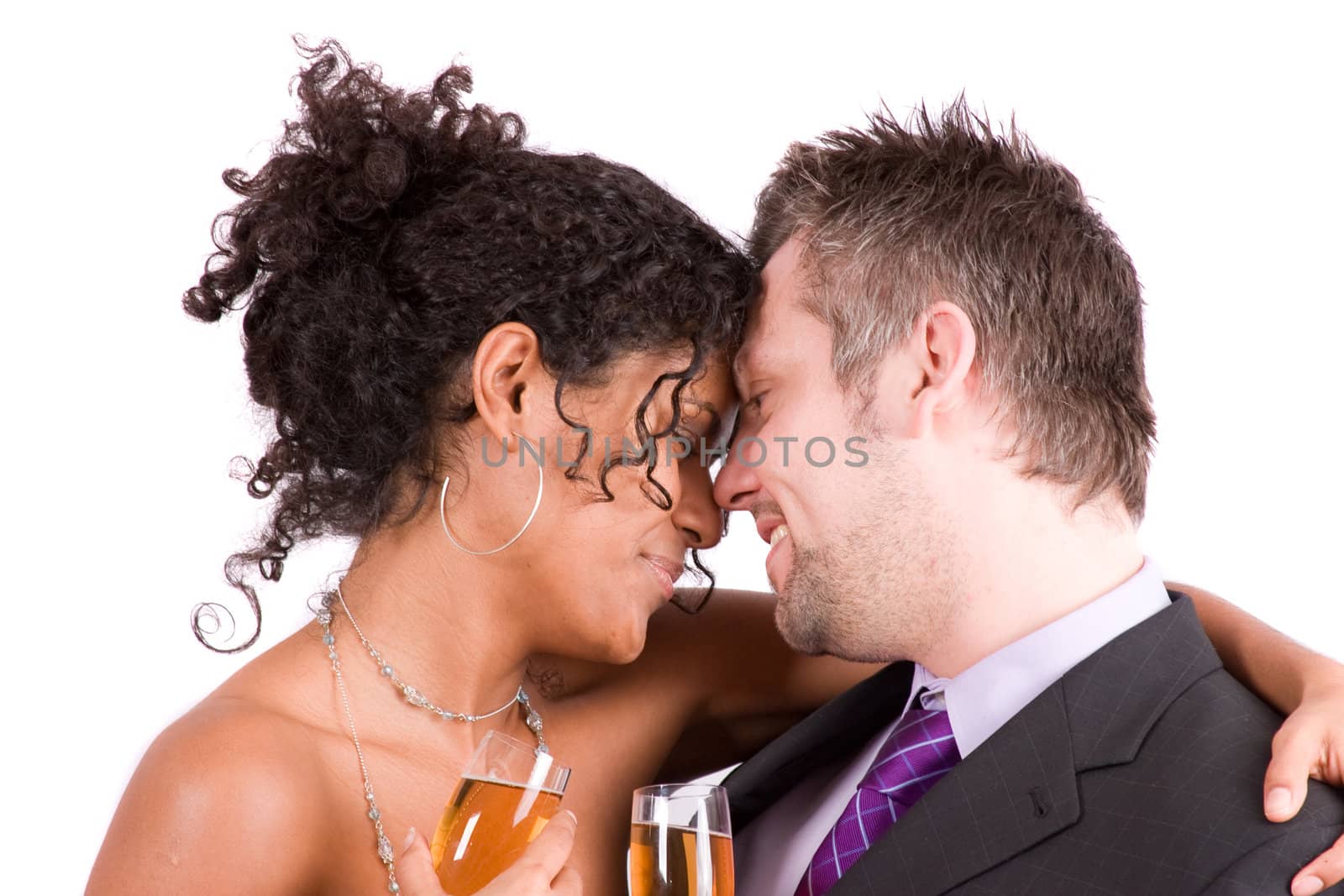 Pretty romantic couple hugging eachother close on white background