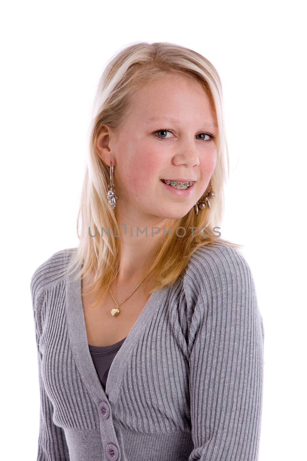 Pretty blond teenage girl with braces smiling