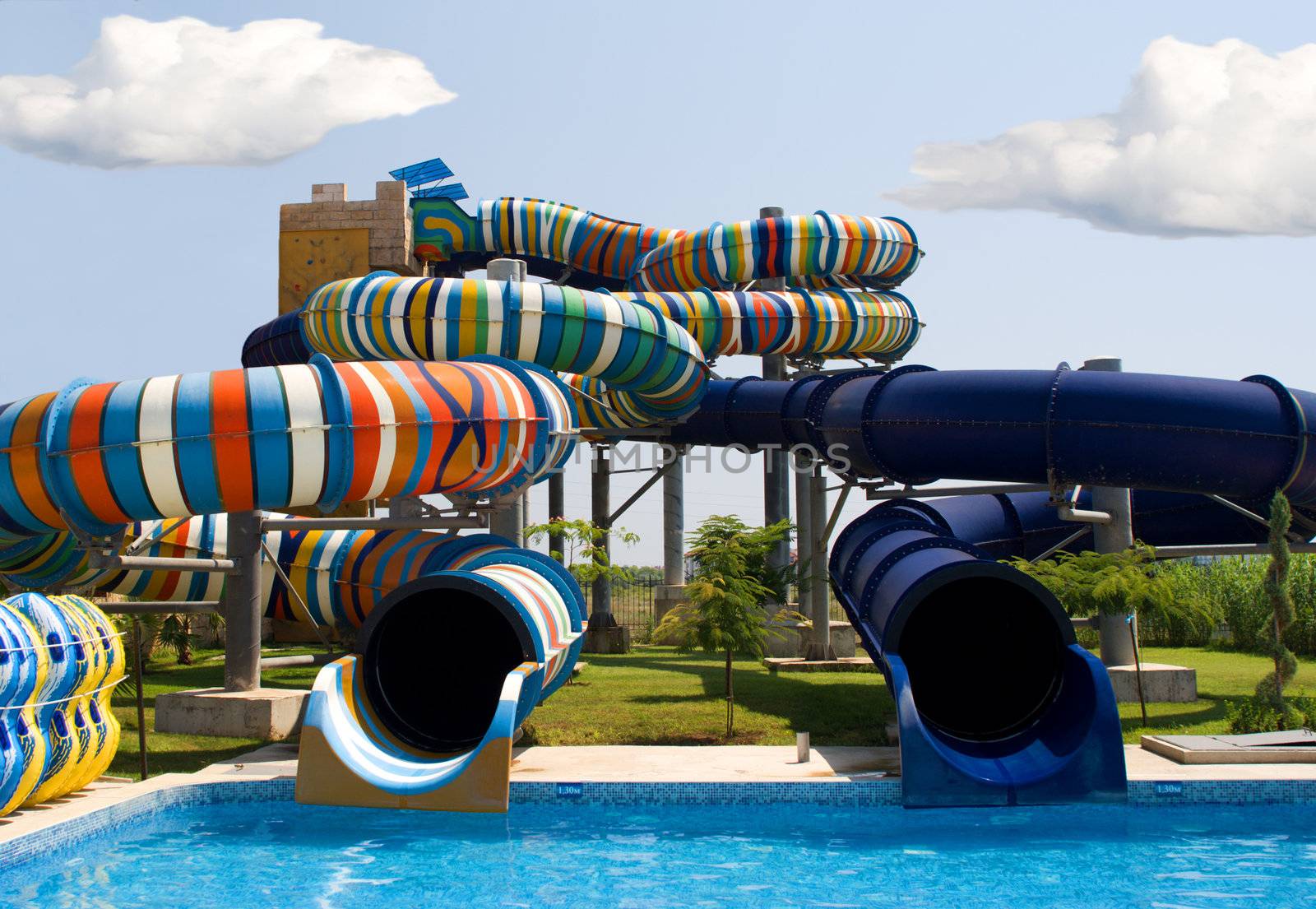 Aqua park in the open air.
Summer, sunny day.