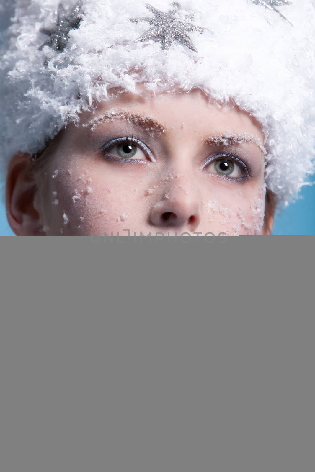 Beautiful girl with snowy head and icy makeup