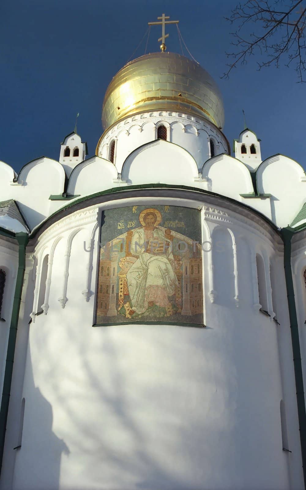 Icon of Christ on the white church wall 