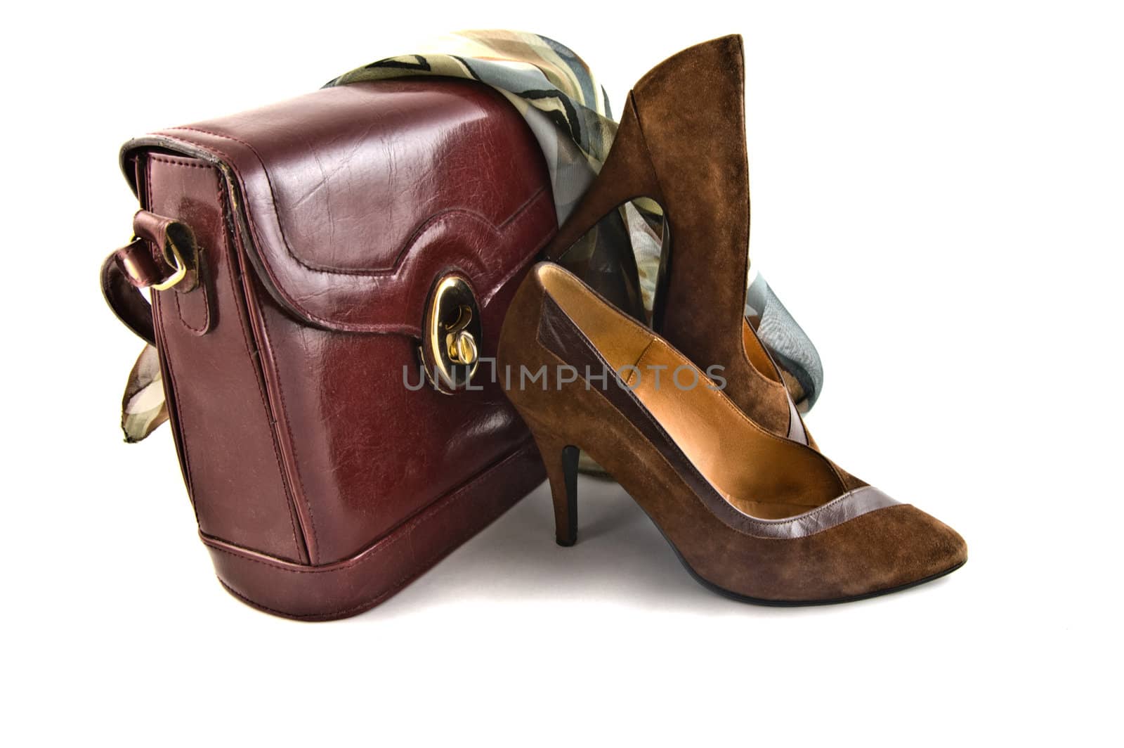 old shoes and bag on white background isolated by galcka