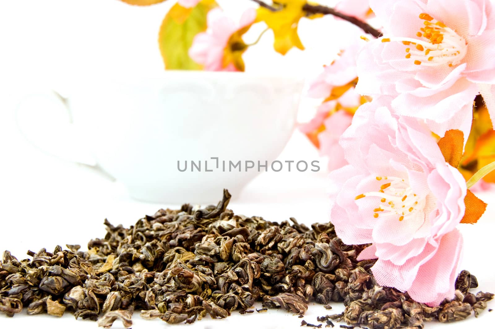 leaves of green tea on white isolated background by galcka