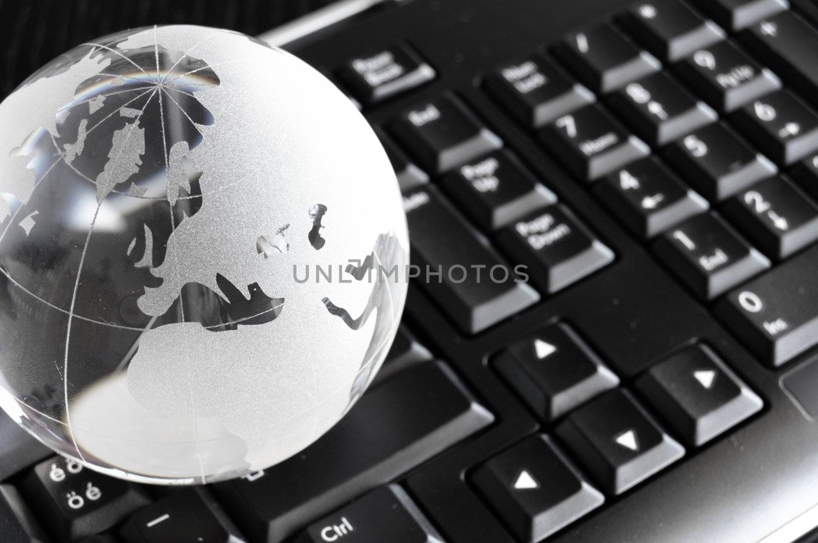 globe and keyboard showing global communication or internet concept