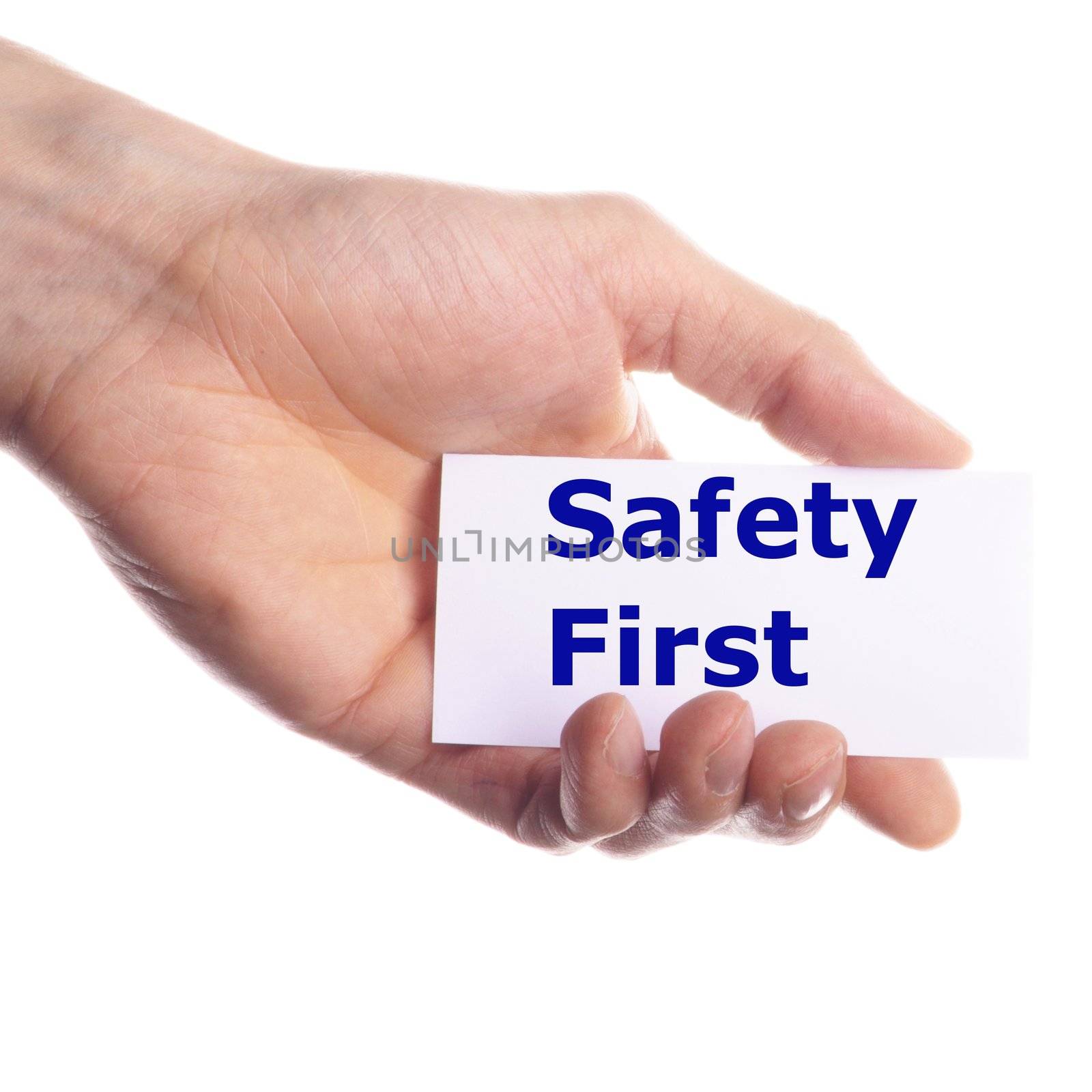 safety first concept with hand word and paper